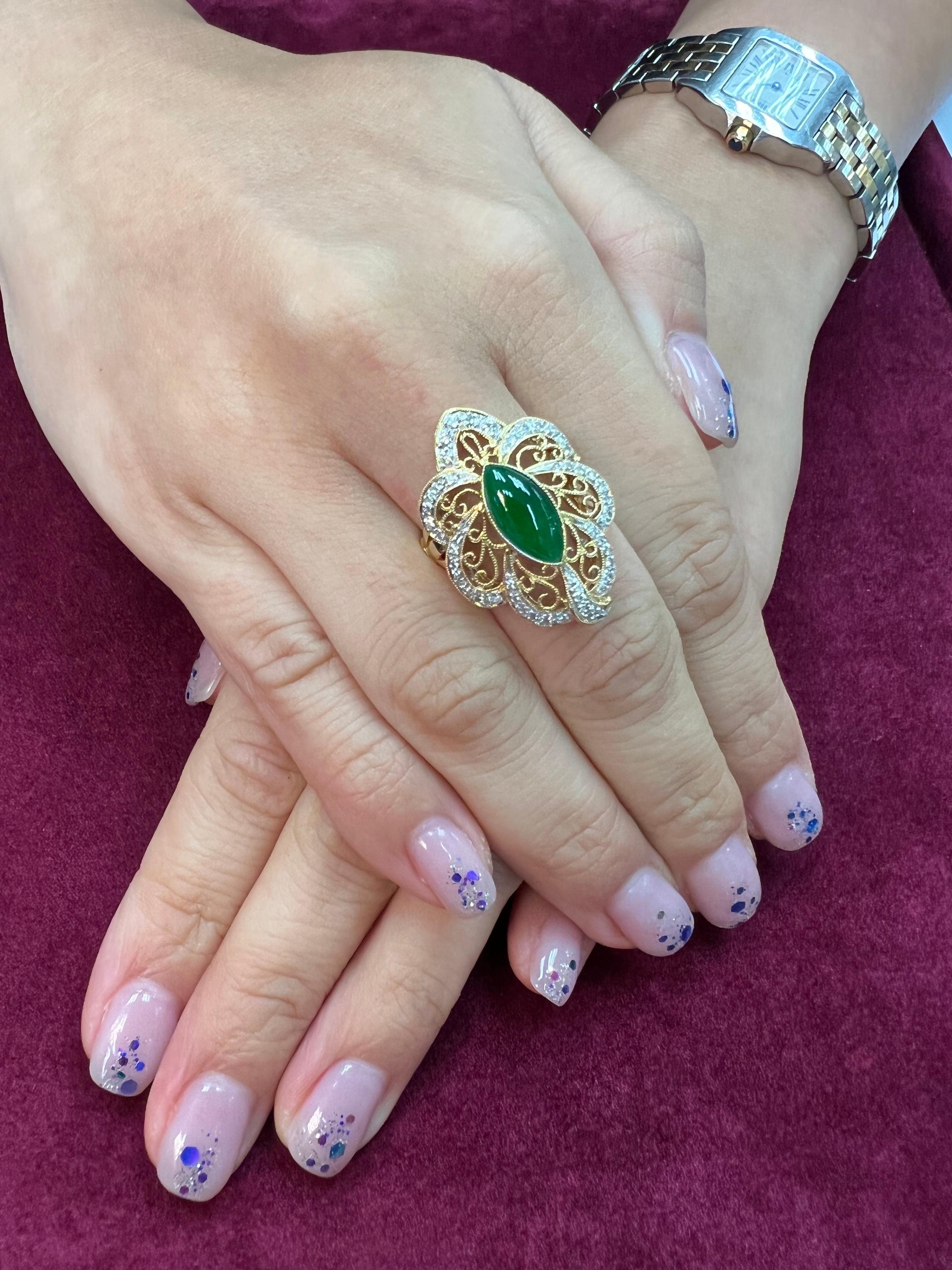 Please check out the HD video. This is an intense apple green Jade and diamond ring. It is certified. The ring is set in 18k yellow gold and diamonds. There are 54 diamonds totaling 0.63cts that surrounds the intense apple jade center stone. The