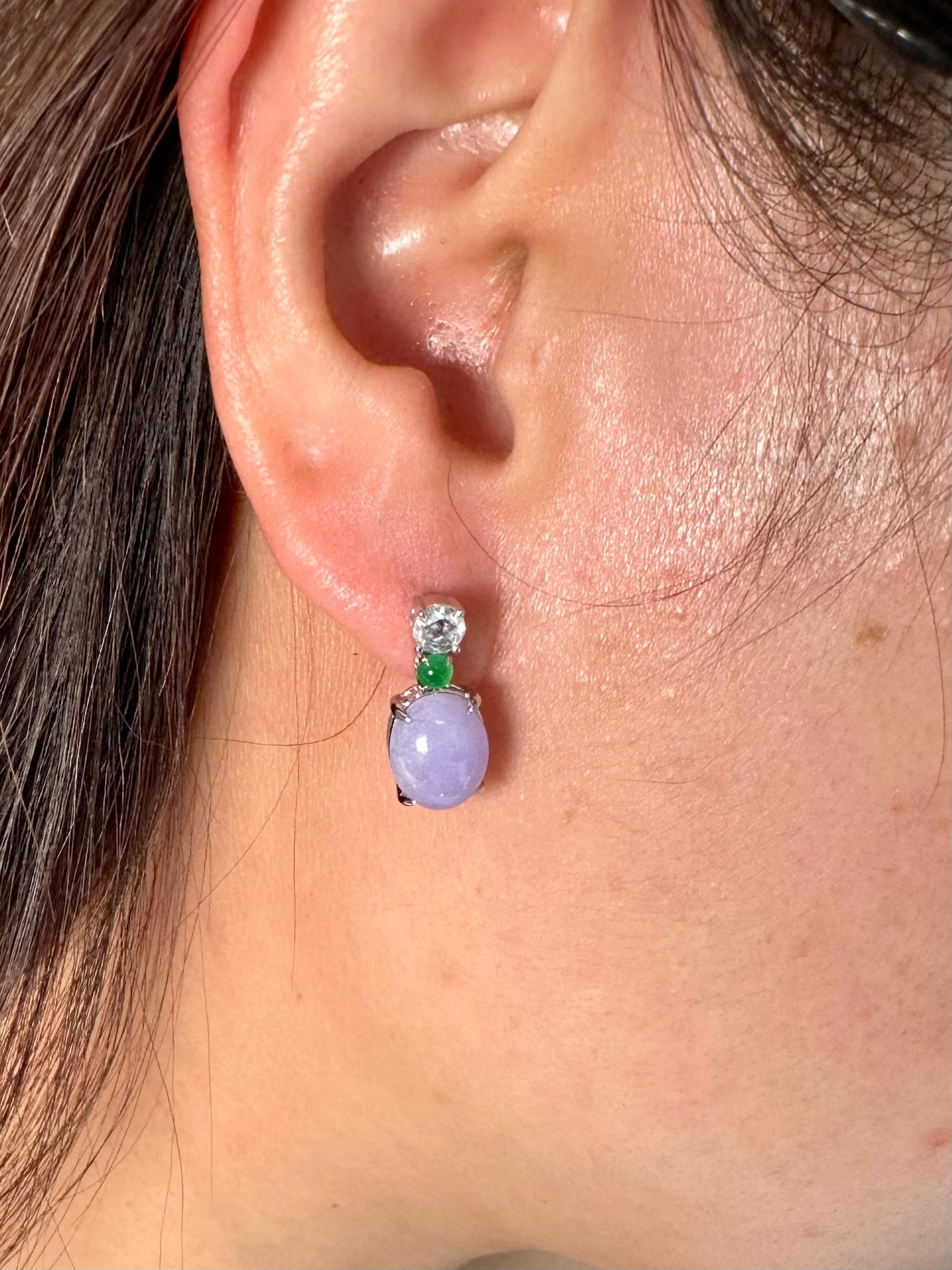 Please check out the HD video. This is a very special pair of drop earrings that are well designed with superb color combination. The lavender / purple jades in these earrings are certified to be natural. The earrings are set in 18k white gold. The