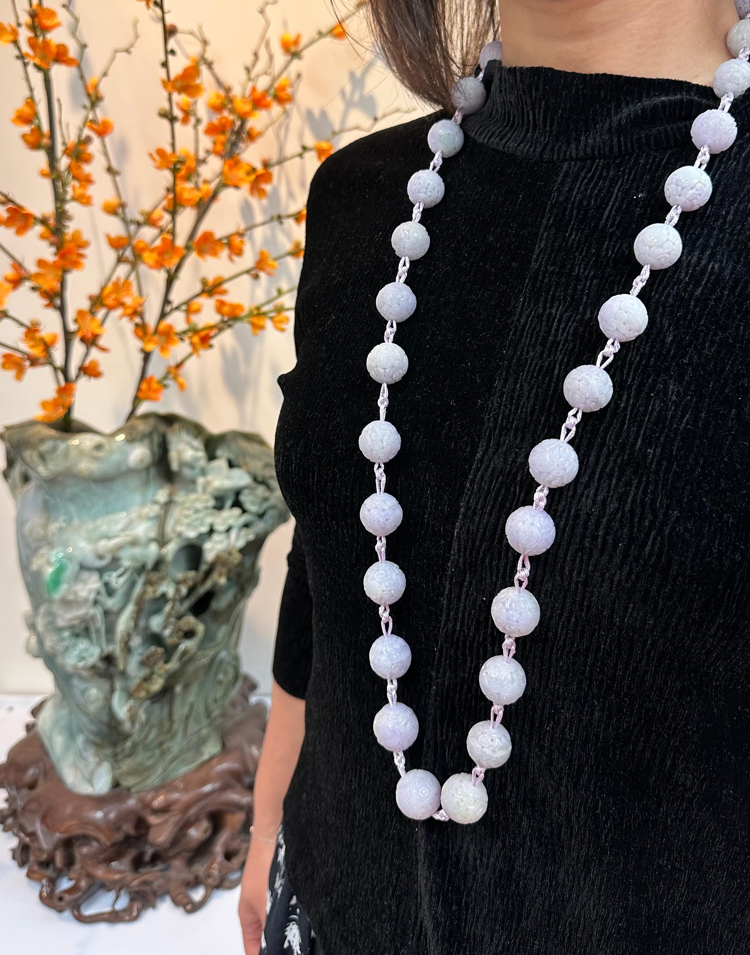 Please check out the HD video! For your consideration is a natural light lavender XXL carved jade bead necklace. Natural light Lavender and light green jade beads of this size are rare and not often seen. There are 31 jade beads ranging from around