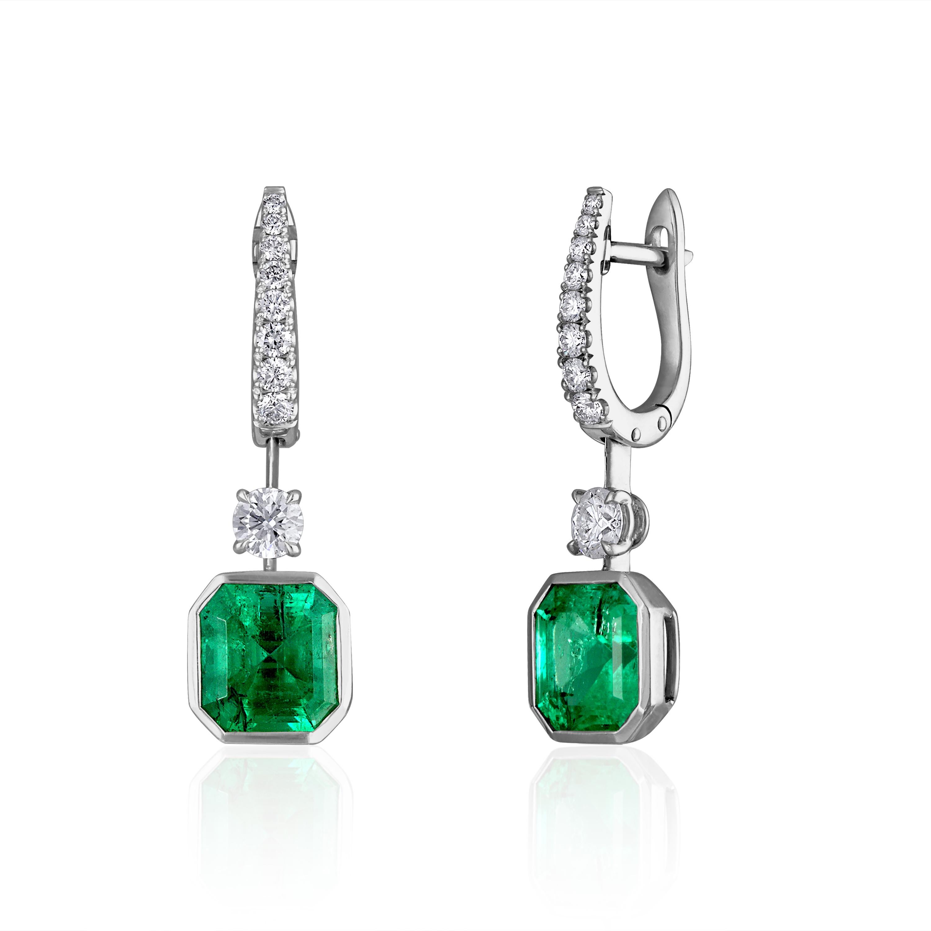 Mindi Mond Exclusive Colombian Emerald Diamond Drop Earrings contain: 

2 Emerald Cut Colombian Emeralds = 6.50 carats total
Origin: Colombia
Treatment: Minor Oil
AGL Report: 1094506A&B

2 Round Brilliant Cut Diamonds and 16 Round Brilliant Diamonds