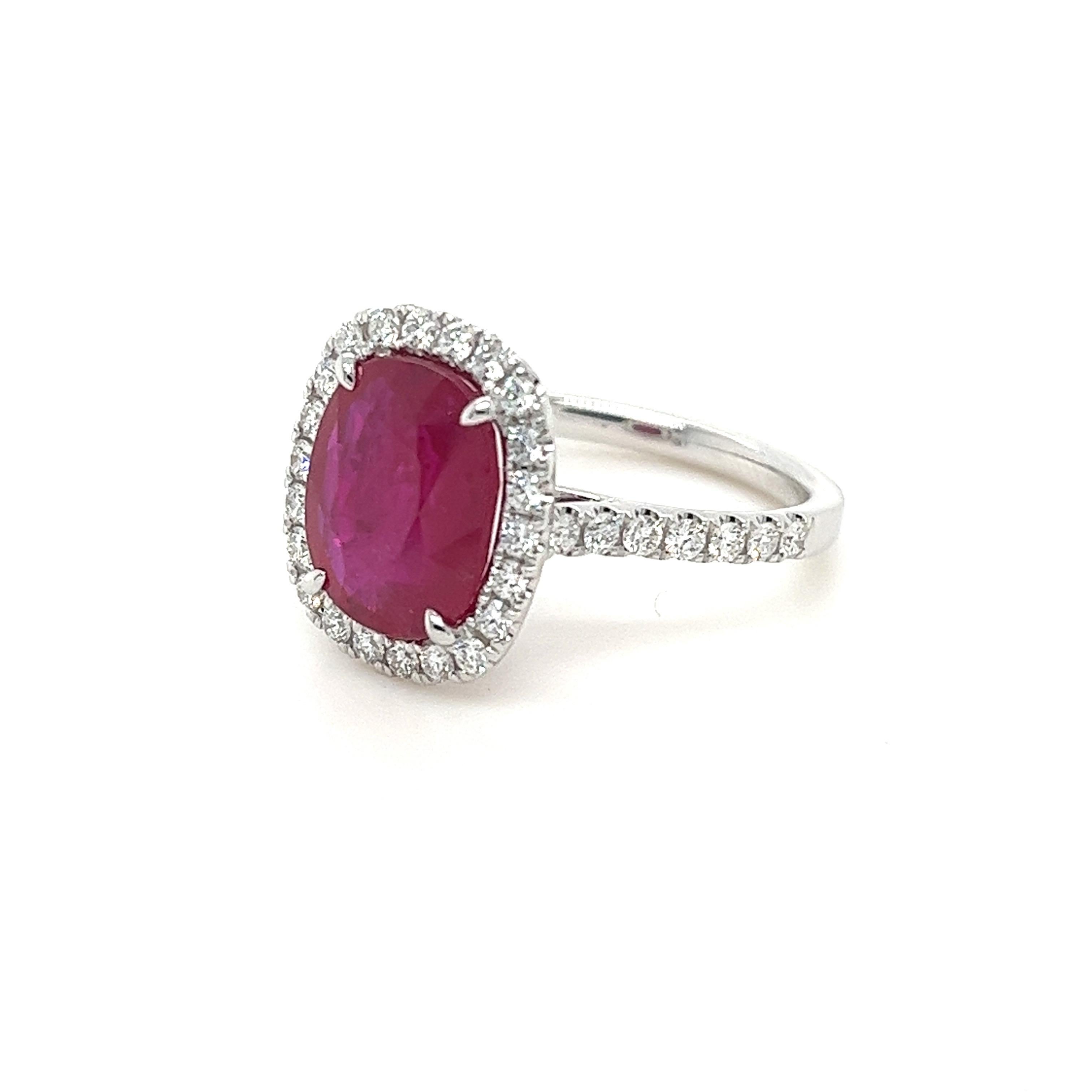 Certified Cushion Mozambique Ruby weighing 4.38 carats
Measuring (11.06x9.04x4.24) mm
Diamonds weighing .61 carats
G-SI1
Set in 18k white gold ring
4.36 g