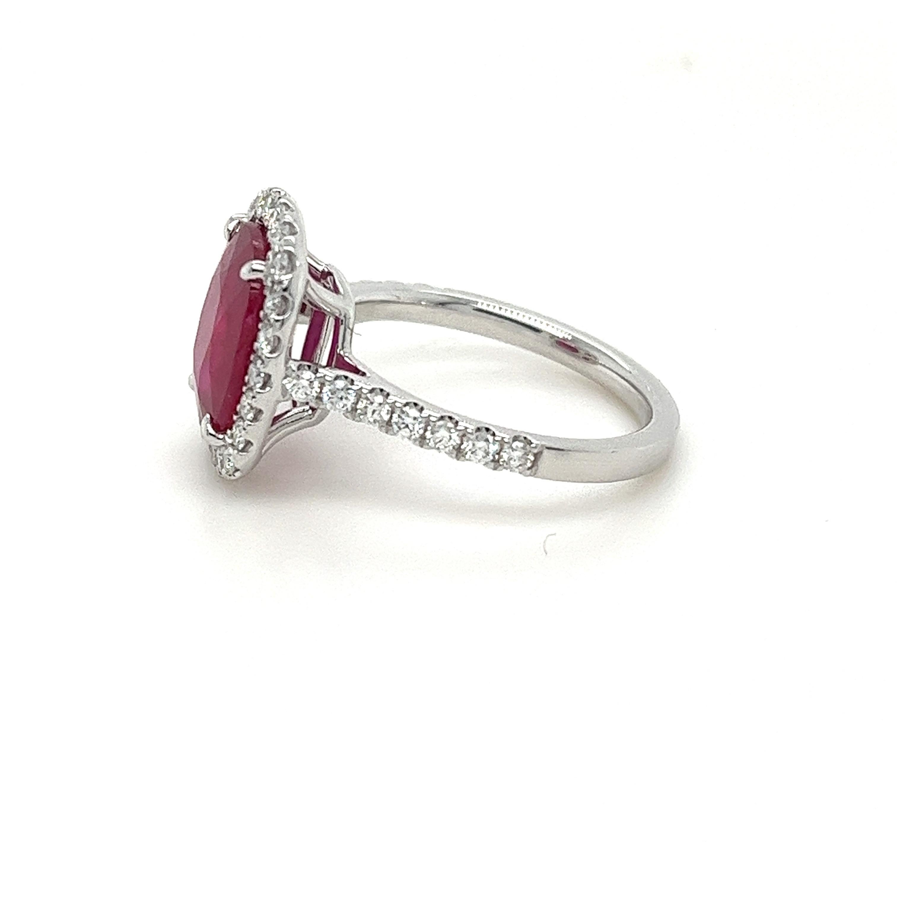 Modern Certified Mozambique Ruby & Diamond Halo Ring in 18 Karat White Gold For Sale