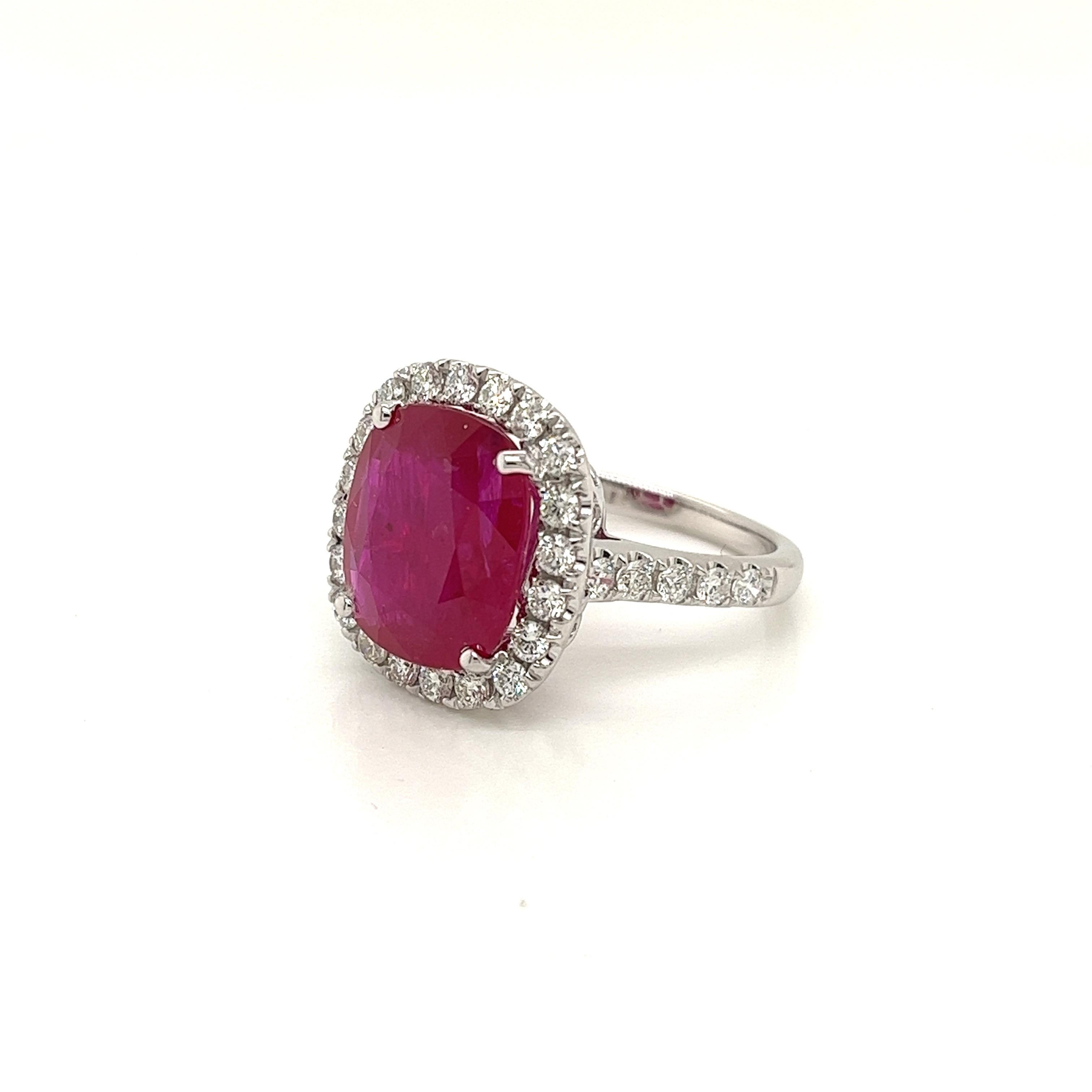 Certified Cushion Mozambique Ruby weighing 6.51 carats
Measuring (12.47x10.84x4.68) mm
Diamonds weighing .89 carats
GH-SI1
Set in 18k white gold ring
5.34 g