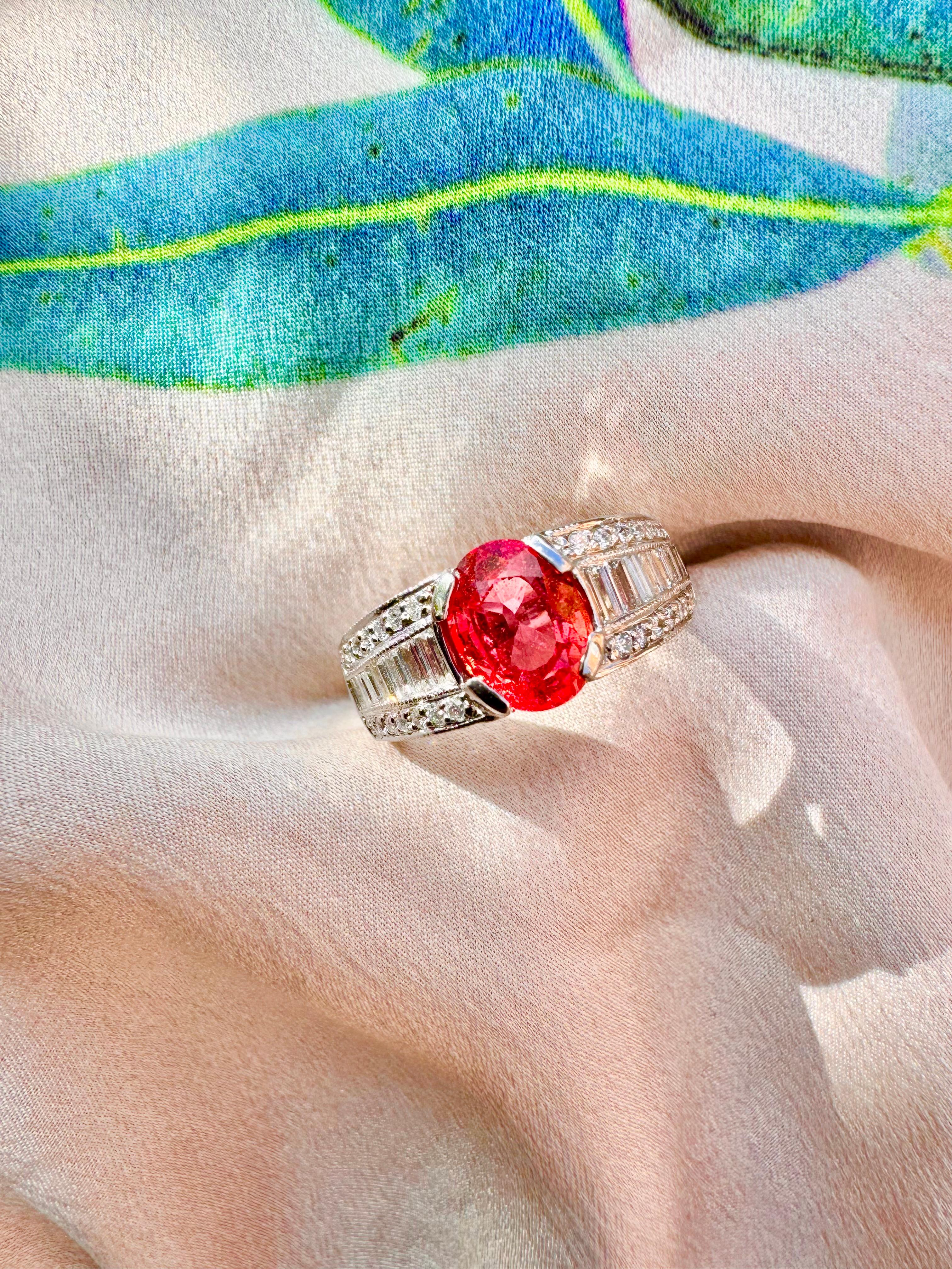 A glowing and fierily sparkling, vintage Padparadscha sapphire and diamond ring, set in a unique platinum setting. 

Specifications: 
Weight of Padparadscha: 1.88 carats
Diamond Weights: 1.04 carats 
Metal Type: Platinum 
Pre-Owned Jewelry