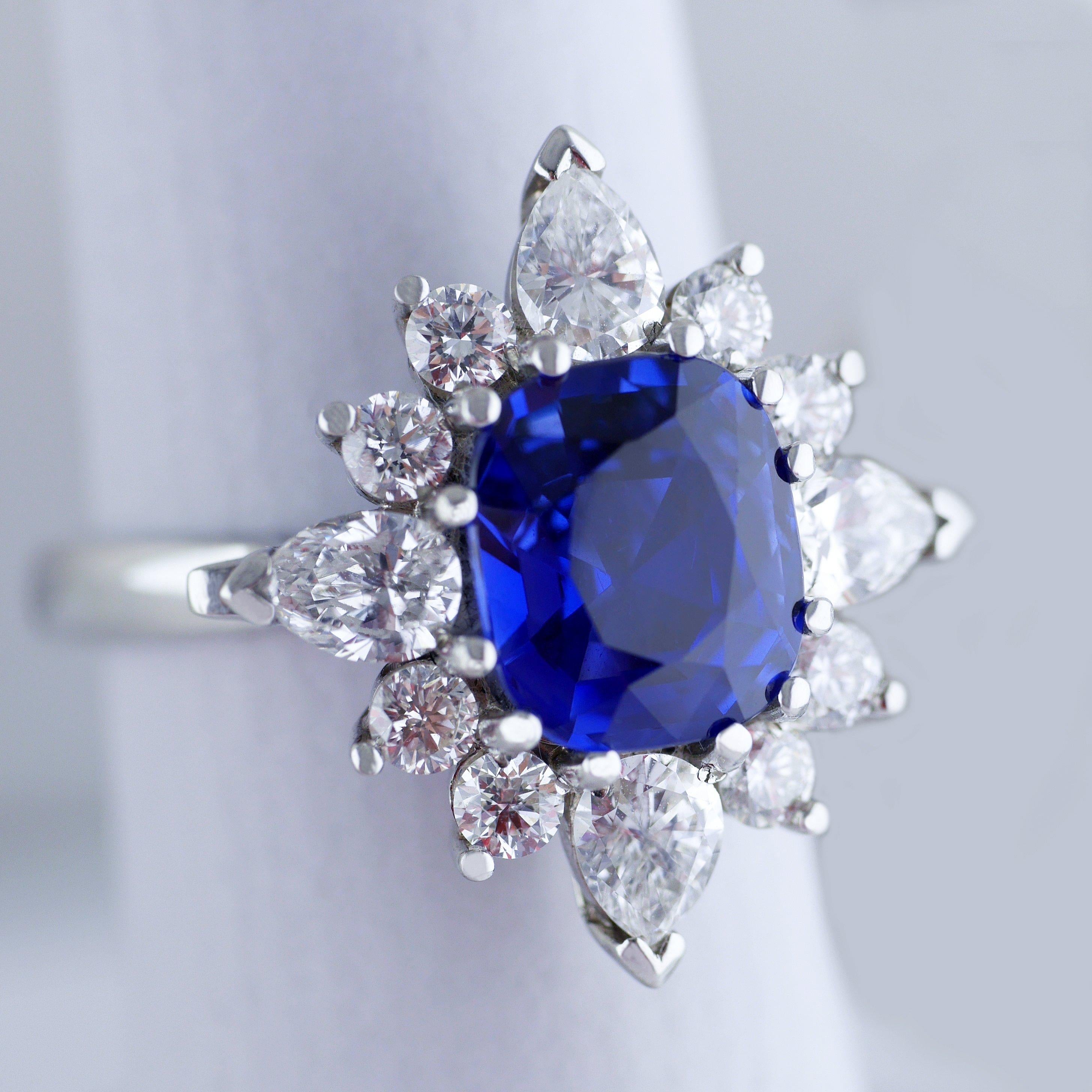 Vintage ring with a fine and lively natural untreated blue sapphire, handmade in England, circa 1960.

Central transparent blue sapphire, rectangular cushion cut, weighing 3.75ct (Carat), certified, natural untreated colour. 

The sapphire