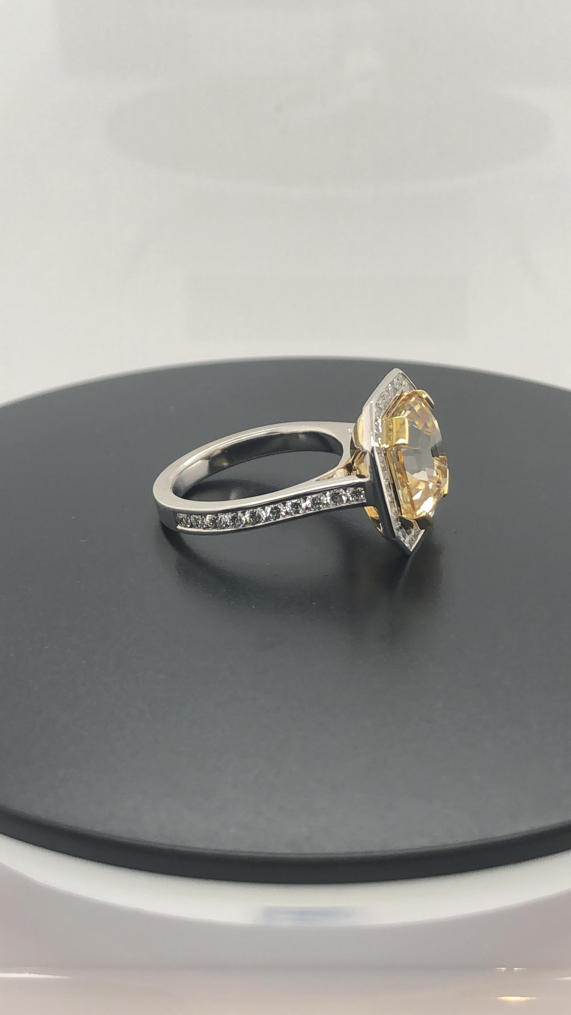 Hand Crafted, 18 Carat Yellow and White Gold Dress Ring, Set with a Certified, Natural, Asscher Cut Yellow Sapphire as per as per C. Dunaigre report # in Yellow Gold End claws, Surrounded by 20 Round Brilliant Cut diamonds, Weighing 0.40 Carats,