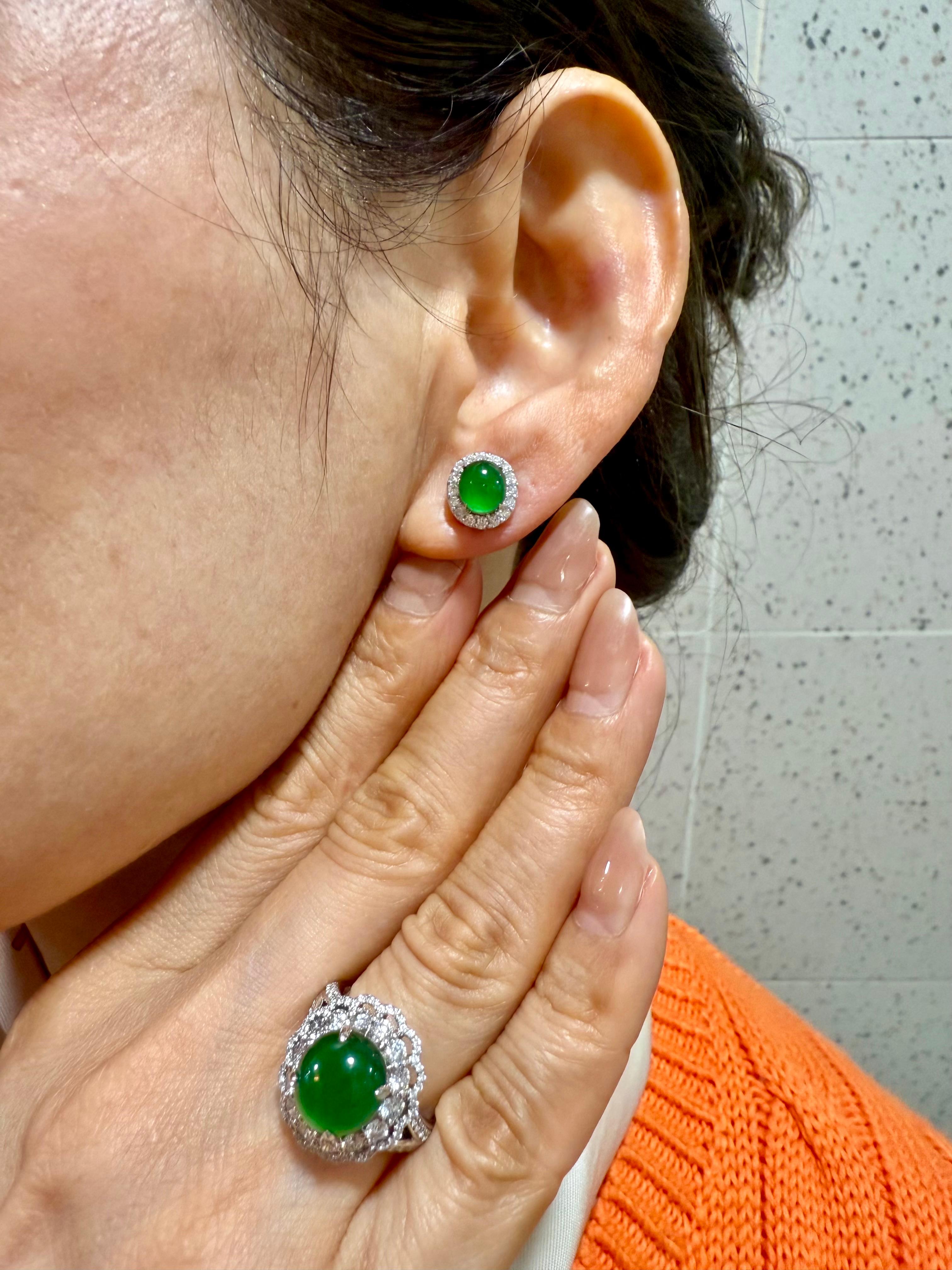 Please check out the HD video! Here is a nice pair of apple green Jadeite Jade earrings. It has the excellent glowing green color. The earrings are about 10.0mm x 9.5mm each in outer diameter. The jade cabochon itself measures about 6.7mm in