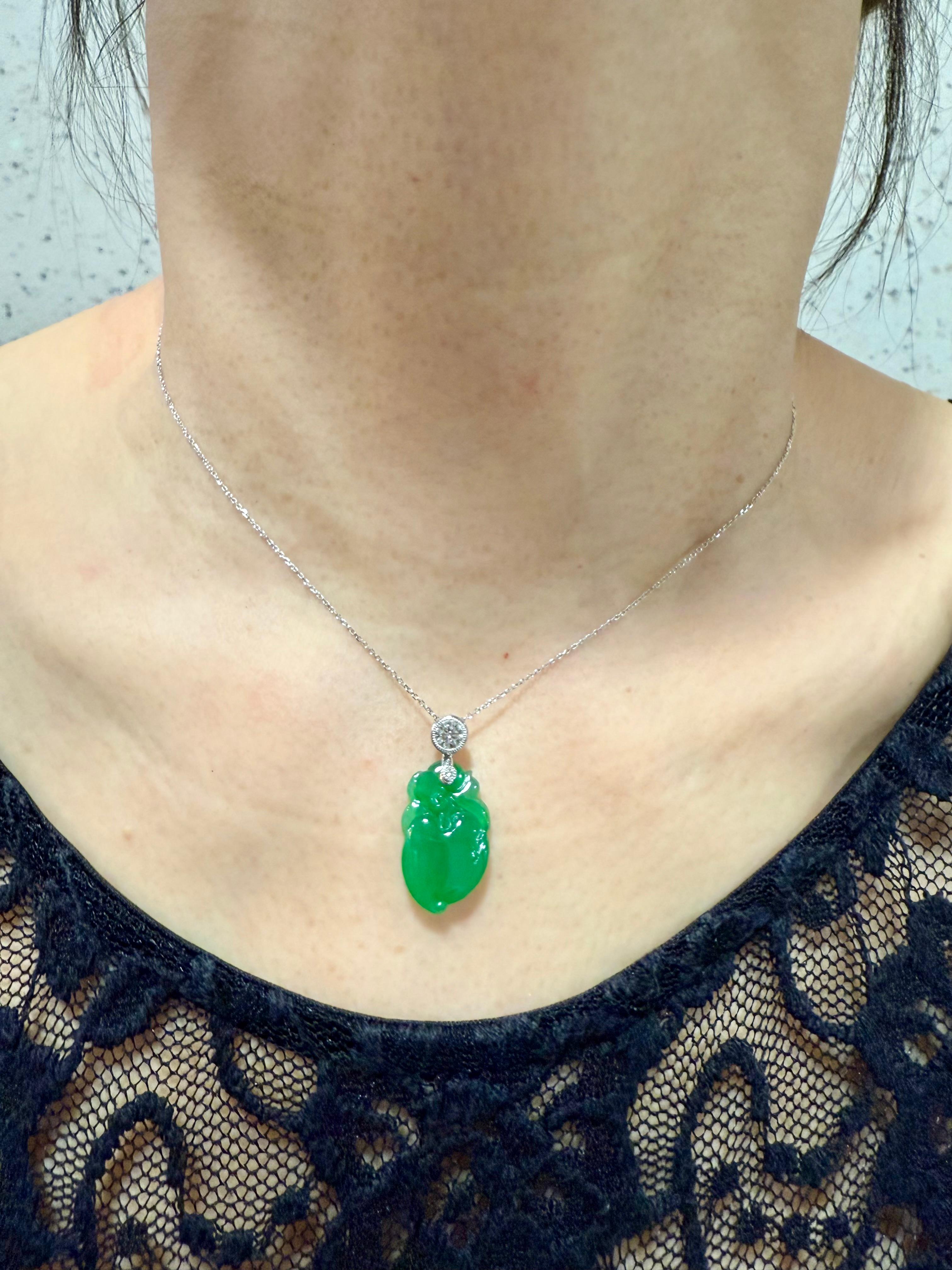 Please check out the HD video. This carved peach jade has a beautiful balance of color saturation and transparency! The jade is thick at 4.1mm with even apple green color throughout. The jade is certified to be natural without any treatments. The