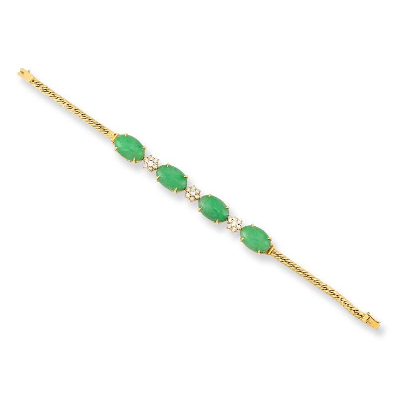 Gorgeous Estate 18K yellow gold bracelet featuring four beautiful, natural, untreated apple green jadeite jade oval cabochons -approx. 10 x 14 x 3.5mm each stone set with diamond flower cluster spacers of 7 round diamonds each. Diamond total weight