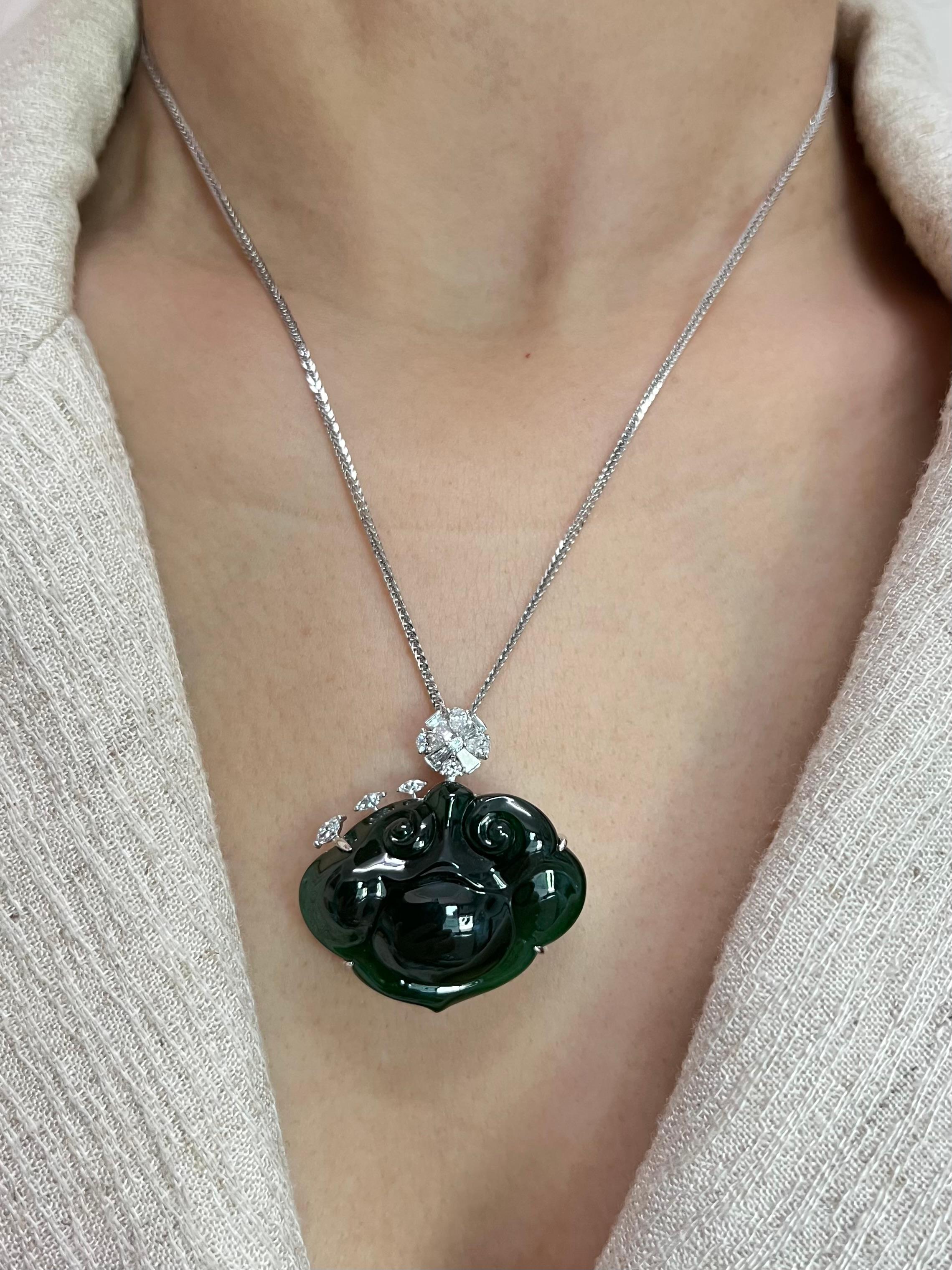 Please check out the HD video. Here is a substantial and natural intense green Jade and diamond pendant. The jade is certified by 2 different labs to be natural and without treatments. The carving of 