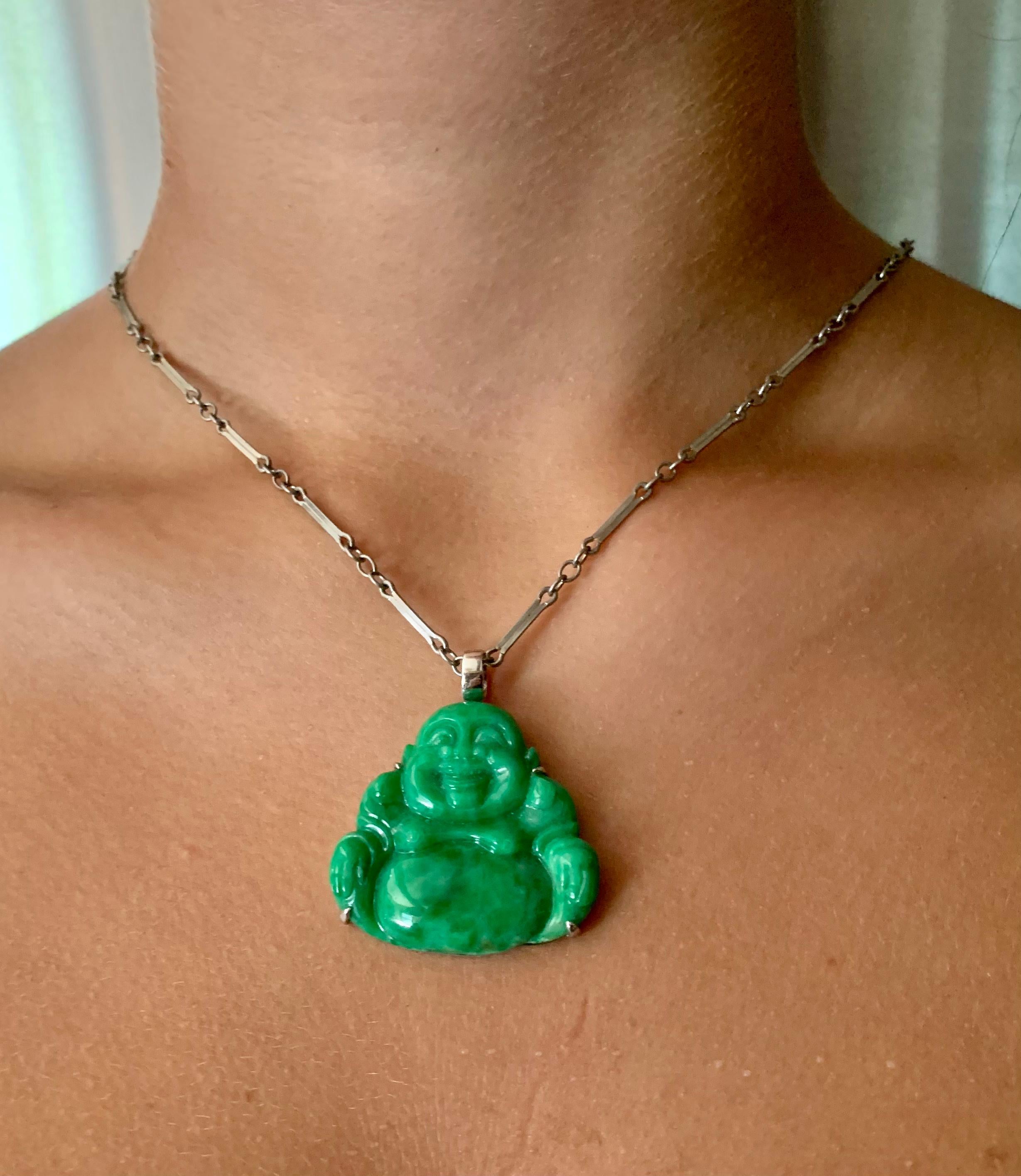 Fine large Apple Green carved jade Laughing Buddha pendant set in 18K white gold.
Hong Kong Gems Laboratory certificate GL100040 certifying that this pendant is a natural color Fei Cui Type A jade weighing 43.51 carats.
Attributed to David C.A. Lin,