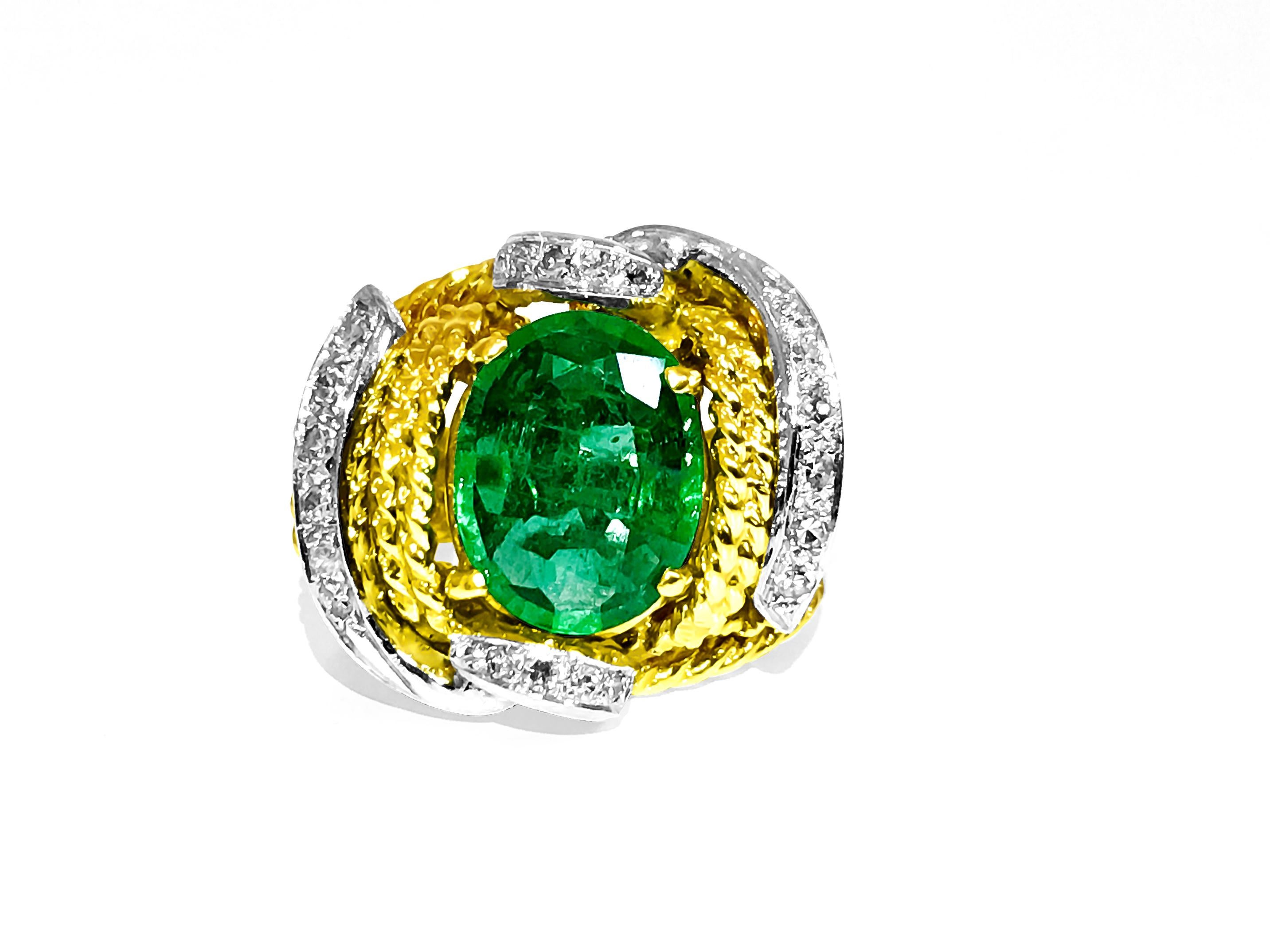 18K Yellow and White Gold (Two Tone). 
3.50 Carat Emerald, oval cut set in prongs. Natural earth mined Emerald. 

0.36 Carat diamonds. Natural earth mined diamonds. VS clarity and F-G color, Round brilliant cut. 

Super quality ring. Great making