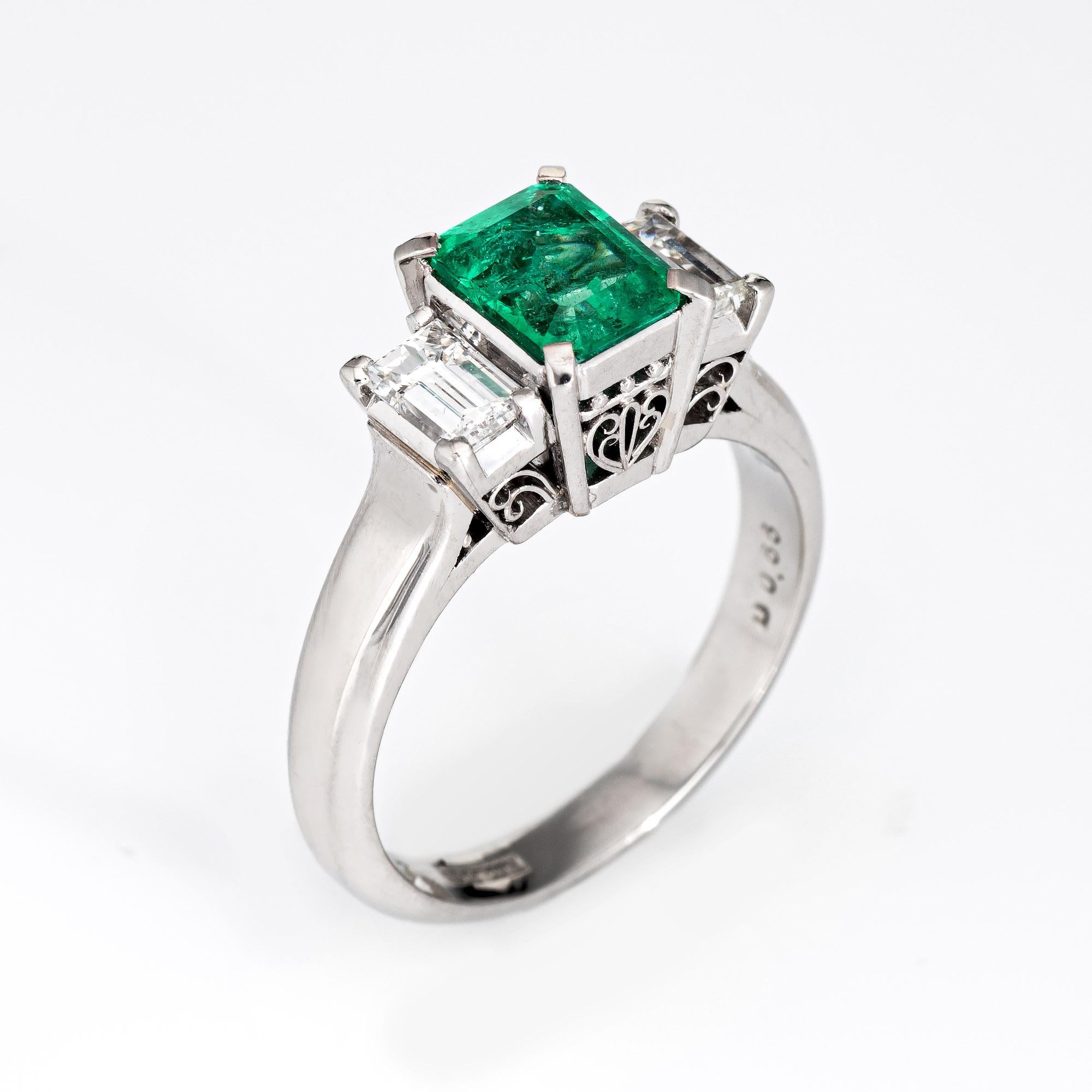 Stylish estate natural emerald & diamond ring crafted in 900 platinum. 

Emerald cut natural; emerald is estimated at 0.90 carats (6.47 x 5.12 x 3.74mm), medium green color, moderately included, good cut, Columbian origin, moderate clarity