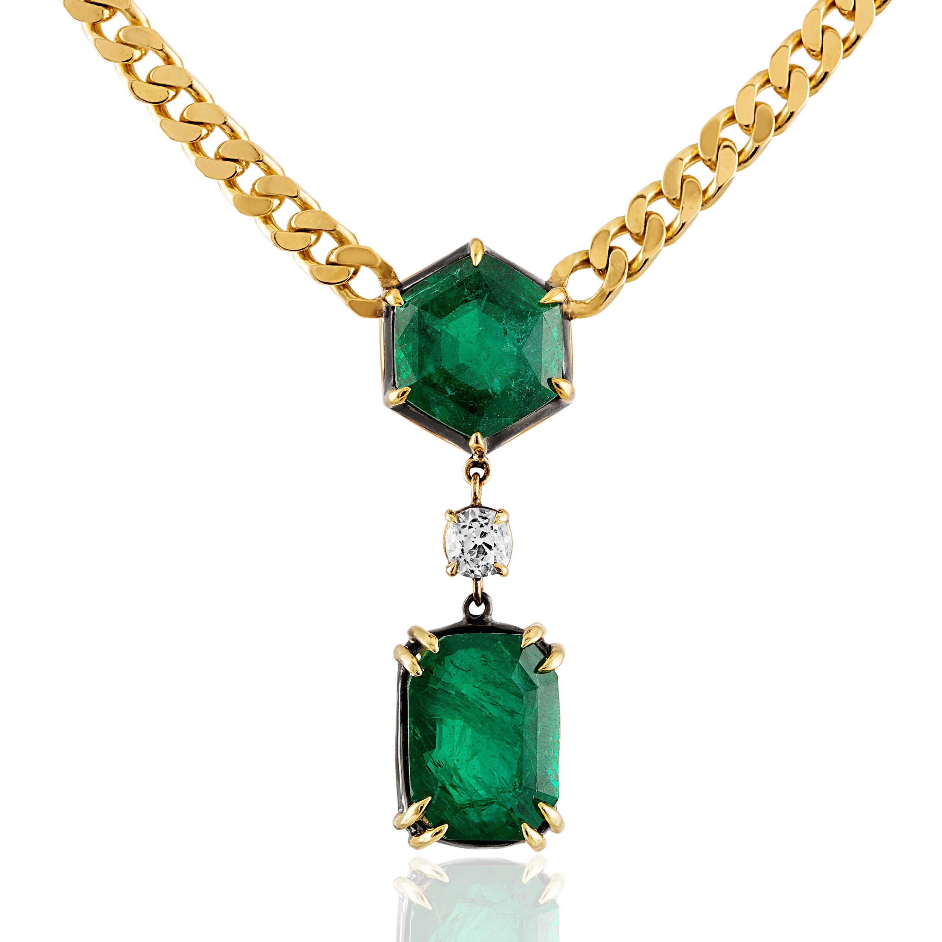 Elegant style by Mindi Mond. 
Two custom cut Zambian Emeralds 7.93 CTW & 11.27 CTW are set in 18k Gold / Silver. 0.60 center Old Cut Diamond. 1-3/4 inches long Emerald to Emerald. 18k Yellow Gold solid link chain is adjustable (2 inches extender)