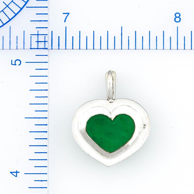 Classic, Beautiful & Natural! The perfect anniversary gift! Gorgeous natural green jadeite jade heart set in a handmade 18K white gold mounting with baguette diamond bail. A Mason-Kay Jade Original Design. 

The green heart is approximately