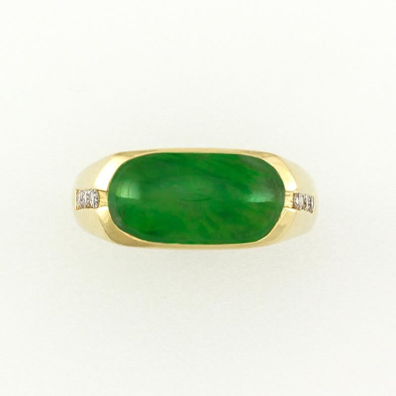 A Jade Classic! Rich natural translucent green jadeite jade saddle stone bezel set east/west across the finger with one row of channel set round diamonds on each side, all set in 14K yellow gold. Finger size 8.75. 

Perfect for a man or