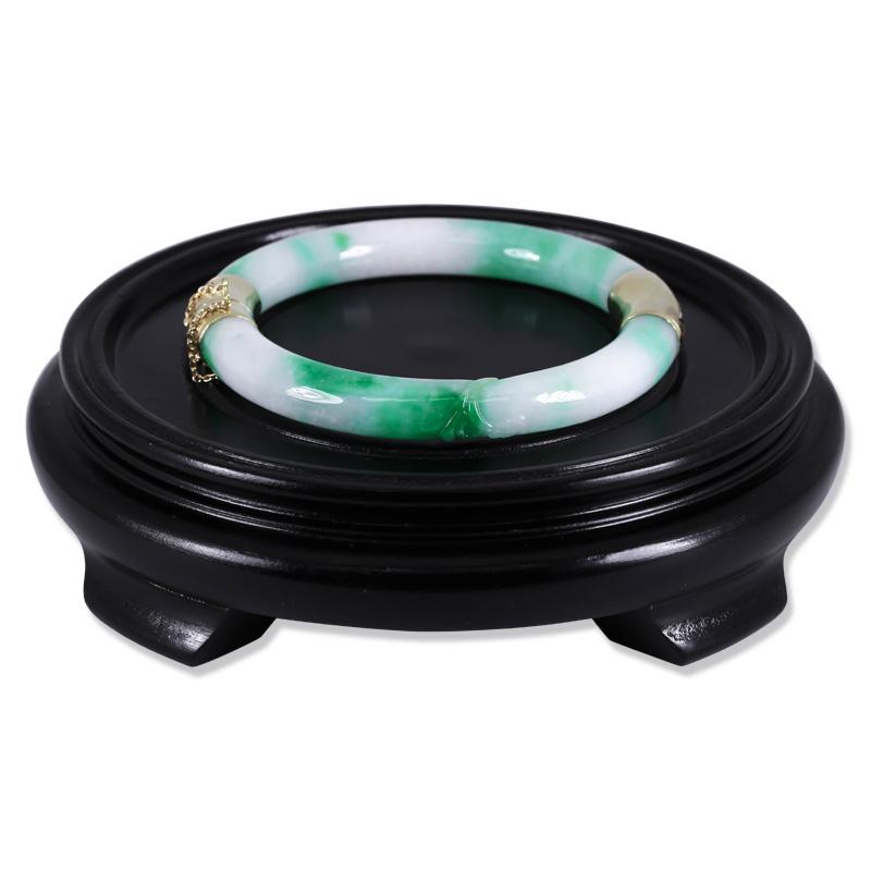 Incredible cylindrical natural green/moss-in-snow jadeite jade two-section bangle bracelet with slight carving on one section and 14K yellow gold hinge and clasp with safety chain. The bangle is approximately 9mm thick and has an inside diameter of