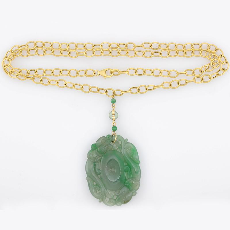 Absolutely gorgeous and a Mason-Kay Original Design! Carved natural untreated jadeite jade carved double dragon pendant on a fabulous fancy 14K yellow gold oval 'ribbed textured' 22 inch chain. The carving is a double dragon carving, 35.5 x 44.8 x