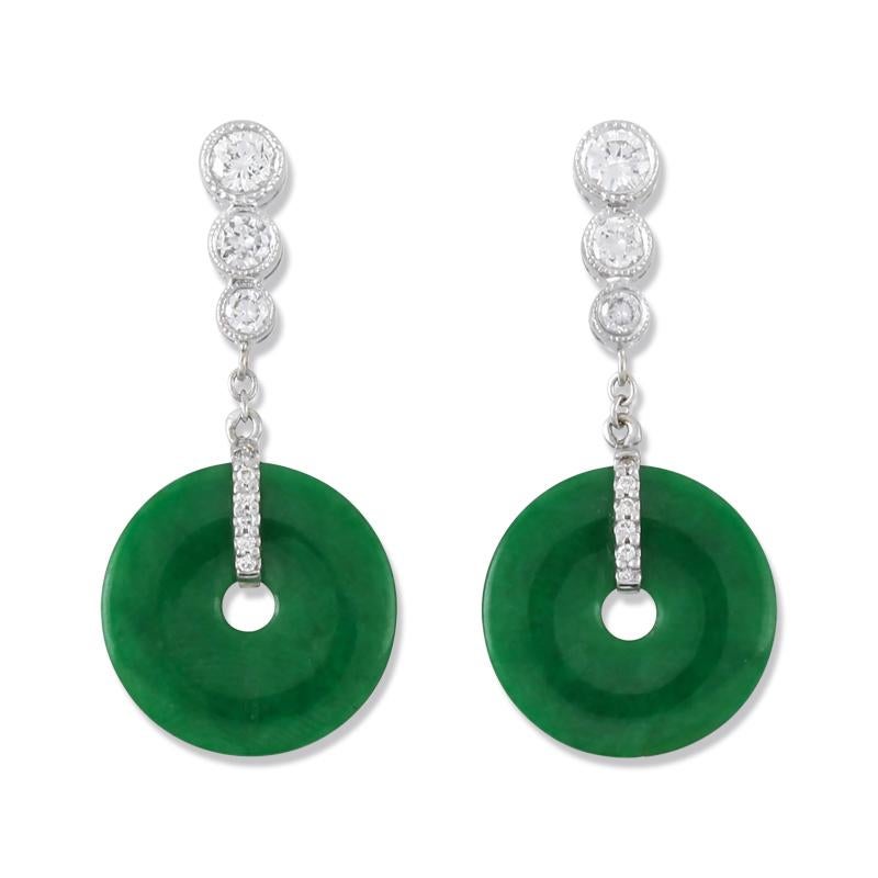 Truly a One-of-a-kind Designer Piece. These very special earrings feature a pair of vivid certified natural green jadeite jade pi discs that are  approximately 15mm set in an amazing 18K white gold & cascading round diamond tops. Total diamond carat