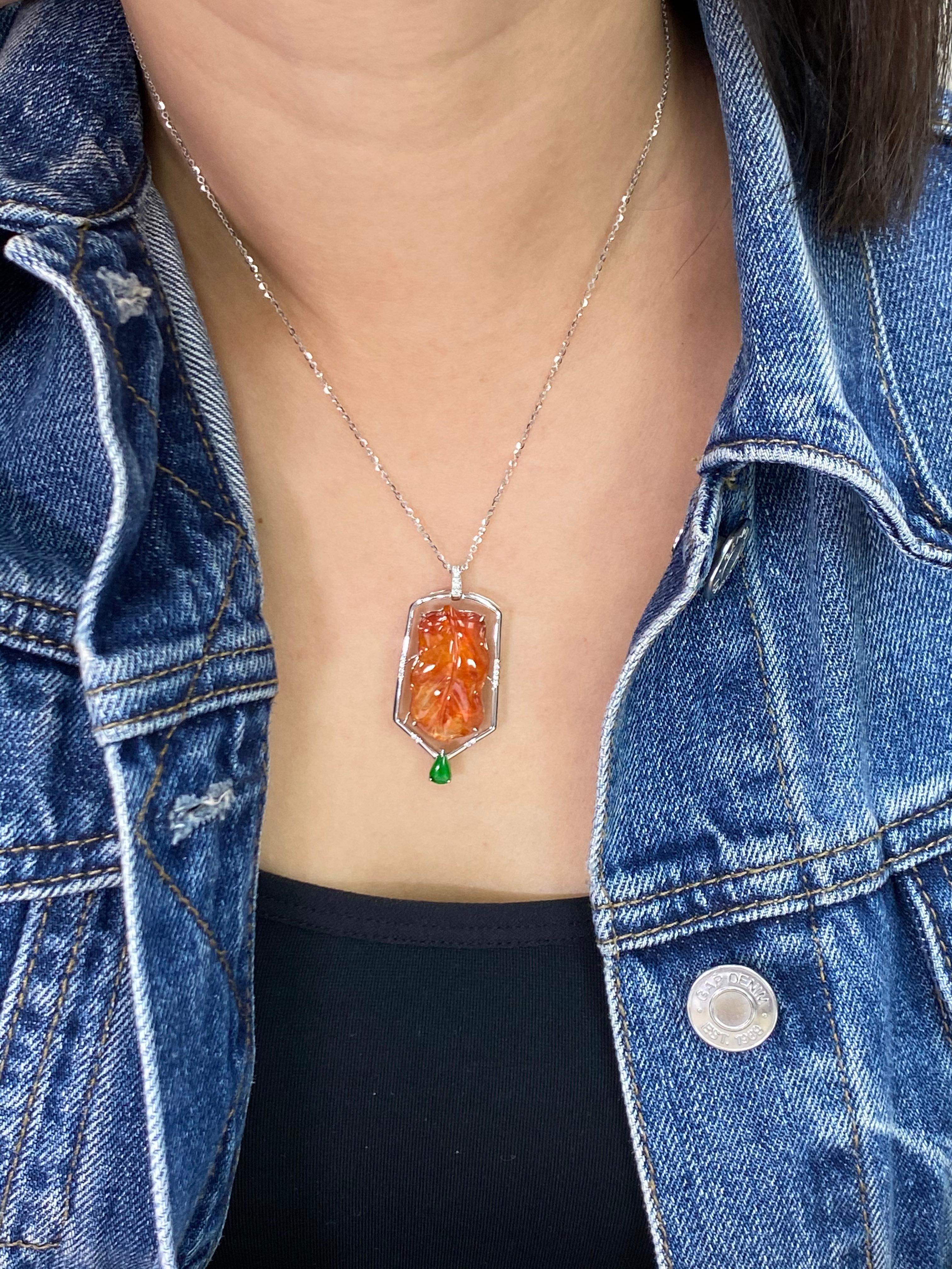 This certified natural red jadeite is not common. It can be beautifully worn with the apple green jade on the top or on the bottom. This pendant drop necklace is designed to be worn two ways for a different look. The red jade is carved with a leaf