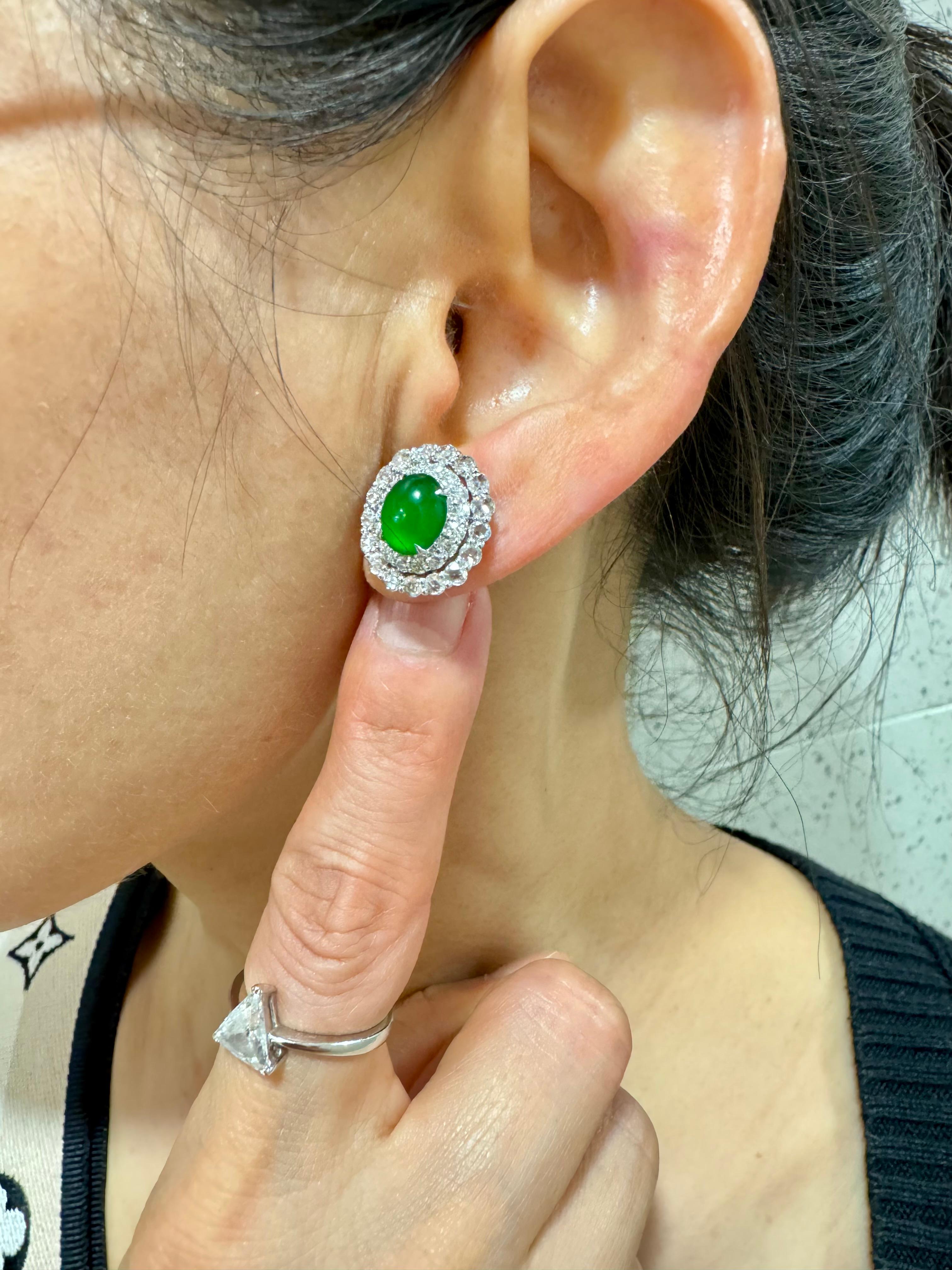 Please check out the HD video! It doesn't get much better than this! Here is a nice pair of true imperial green Jadeite Jade earrings. It has the best of the best glowing green color. The earrings are about 16x14.6mm each in outer diameter. The jade