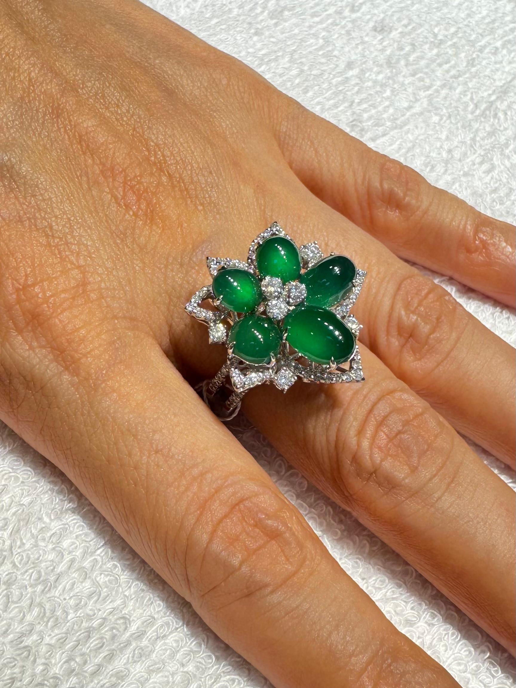 Please check out the HD video. Here is a Jade cocktail ring with the best of the best imperial green color. Almost all jade of this color and quality are color treated. This one is certified natural and without treatment. This ring is set in 18k