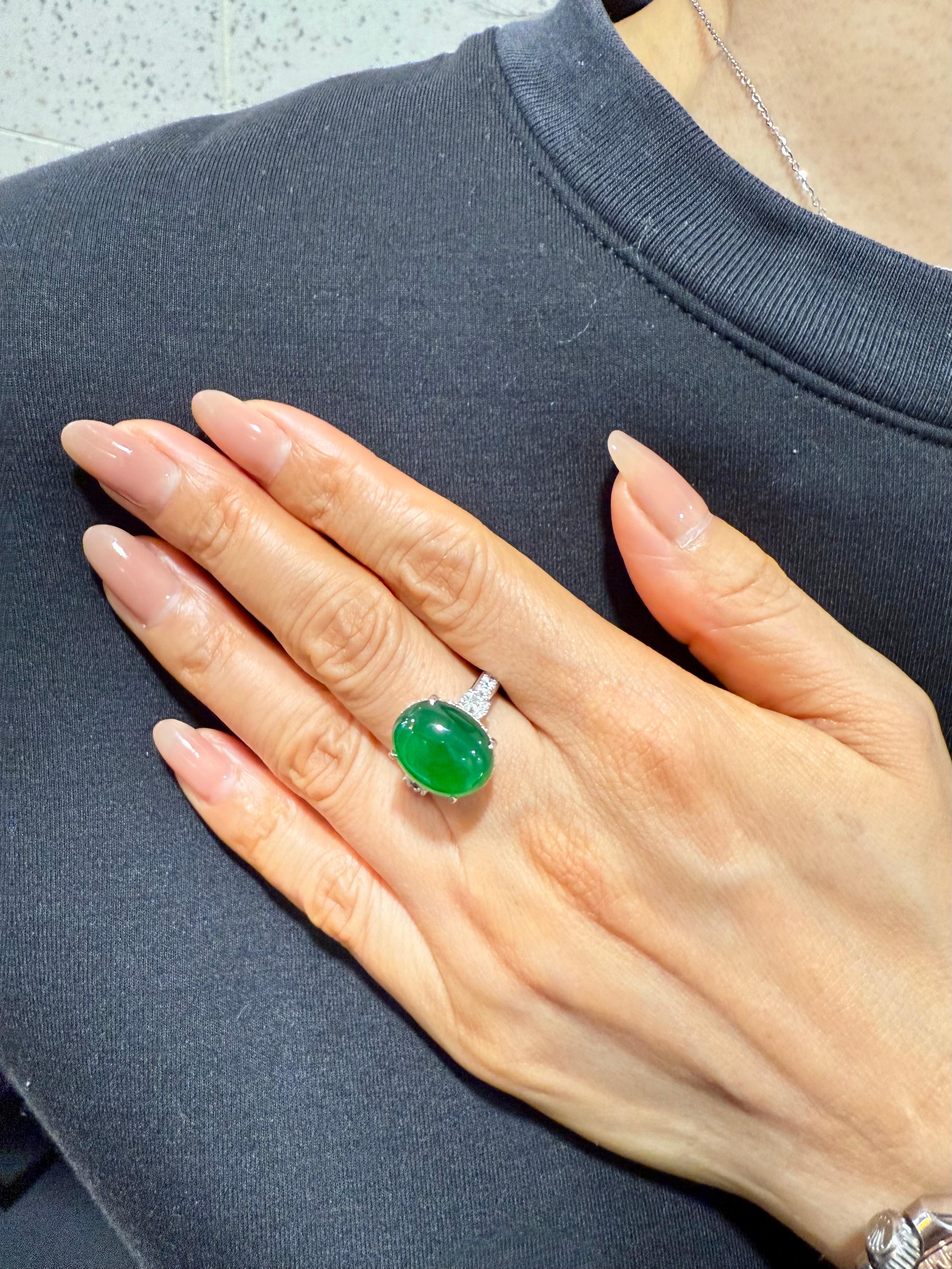 Please check out the HD video. Here is an impressive imperial green Jade cocktail ring. Almost all jades of this color and quality are treated with color enhancement. This one is certified natural and without any treatments. This ring is set in 18k