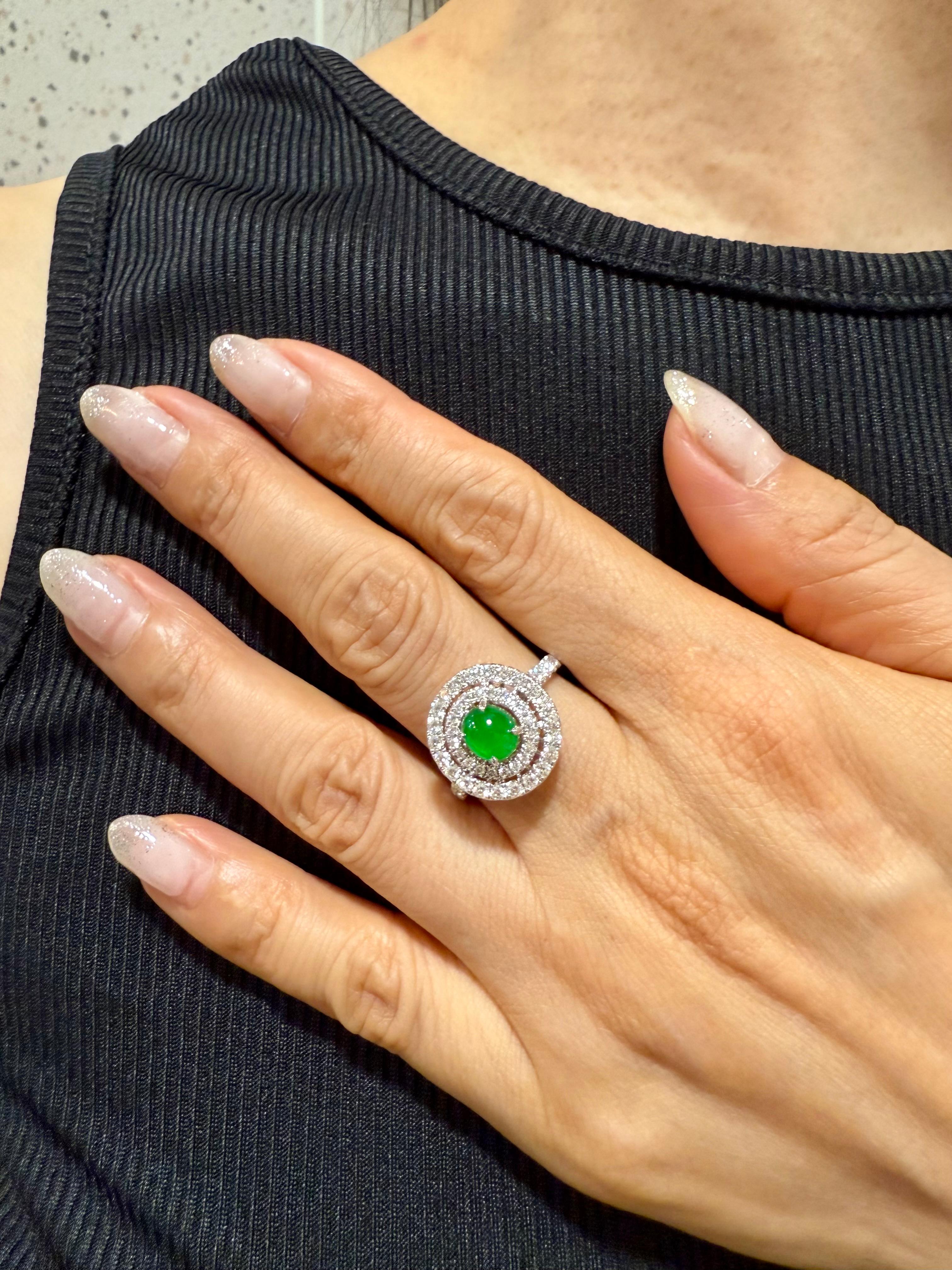 Please check out the HD video. Here is a bright intense apple green oval cabochon jade and diamond cocktail ring. Almost all jade of this color and quality are color treated. This jade however is  certified as natural jadeite jade with no treatment