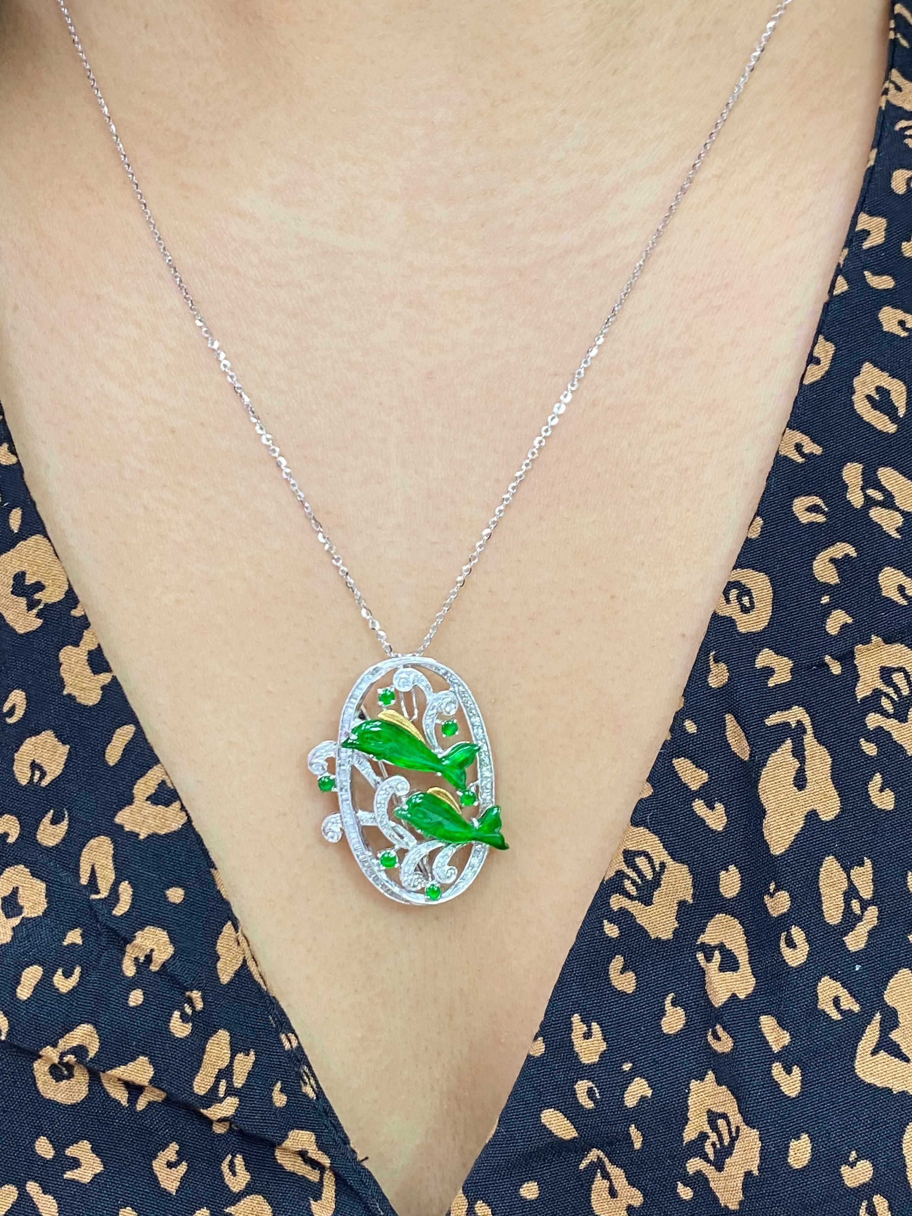 Here is a vivid apple green Jade and diamond pendant / brooch. The pendant / brooch is set in 18k white gold and diamonds. The Jade is certified. This jade dolphins has a nice vivid green color that you will never forget. It actually glows. There