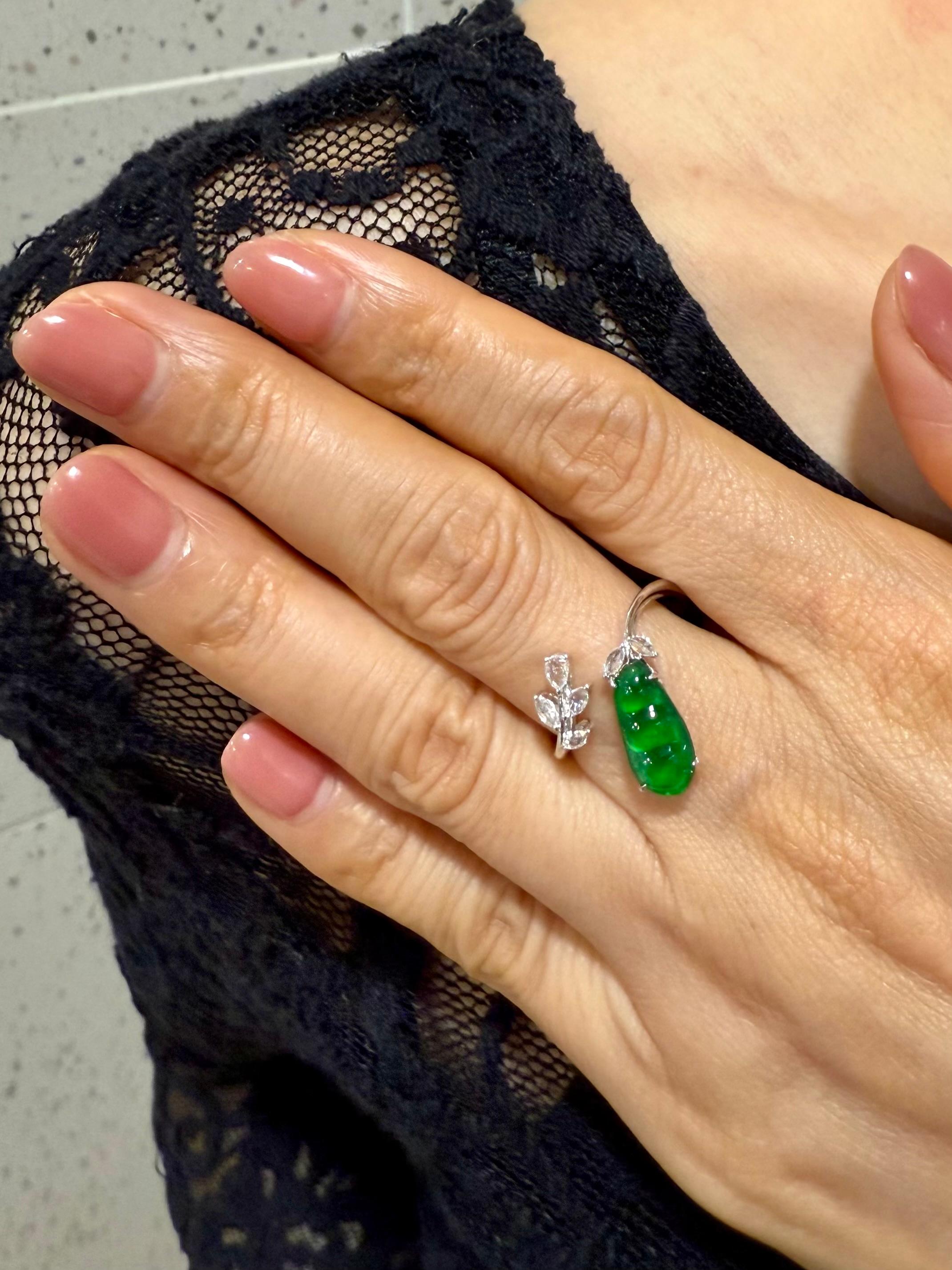 Please check out the HD video. Here is an impressive imperial green Jade ring. Dainty but packs a big punch! The glow on this jade is off charts. Almost all jades of this color and quality are treated with color enhancement. This one is certified