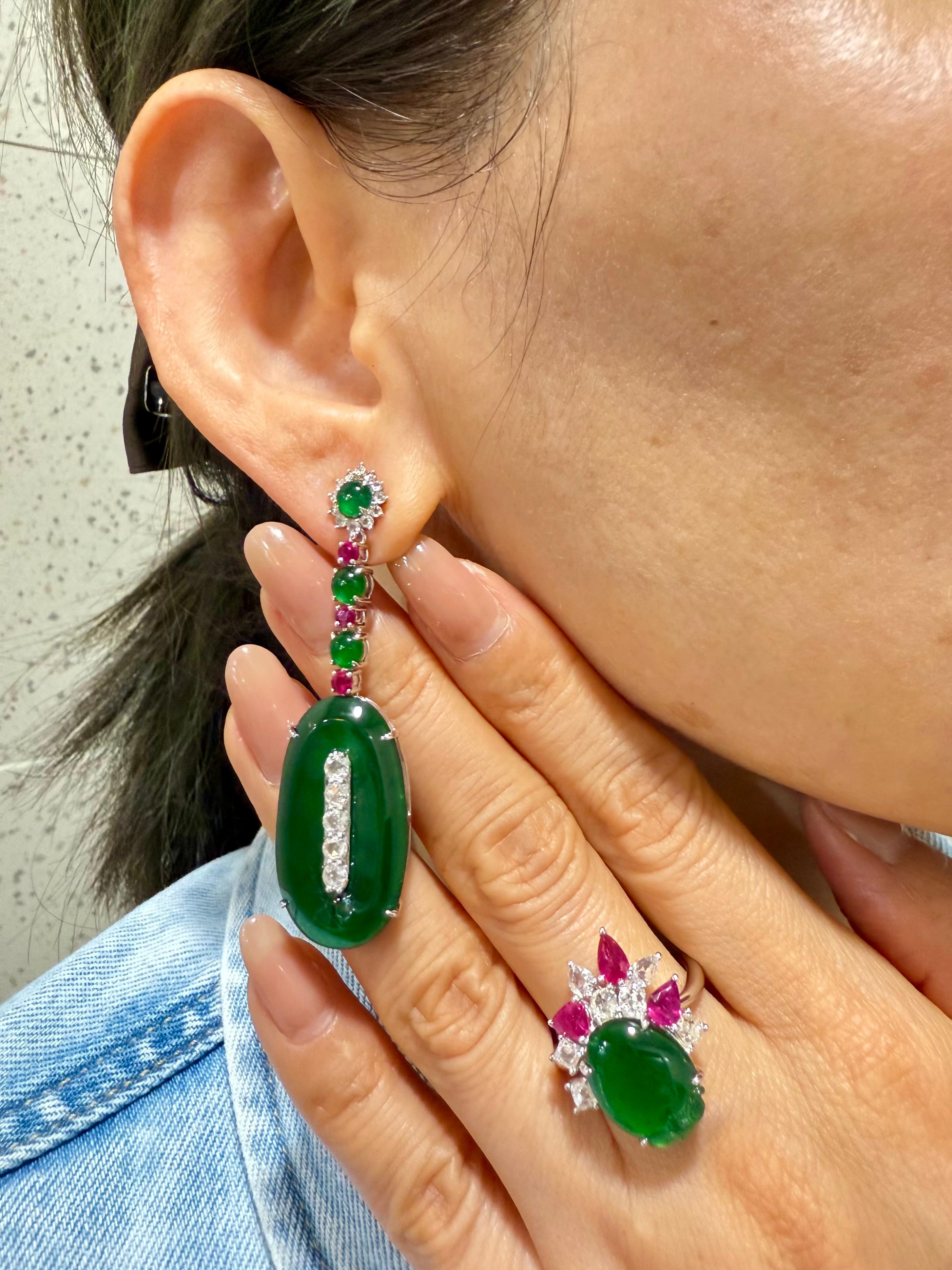Please check out the HD video. Here is an impressive imperial green Jade cocktail ring. Almost all jades of this color and quality are treated with color enhancement. This one is certified natural and without any treatments. This ring is set in 18k