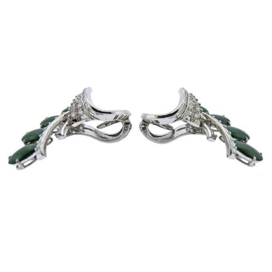 Pair of 14k white gold cocktail Mid Century earrings, set with approx. 0.90ctw H/Si1 diamonds and EGL certified 4.40ctw jadeite jade.  Earrings are 33mm x 24mm. Weight - 13.1 grams. Marked: T & C, 585. 