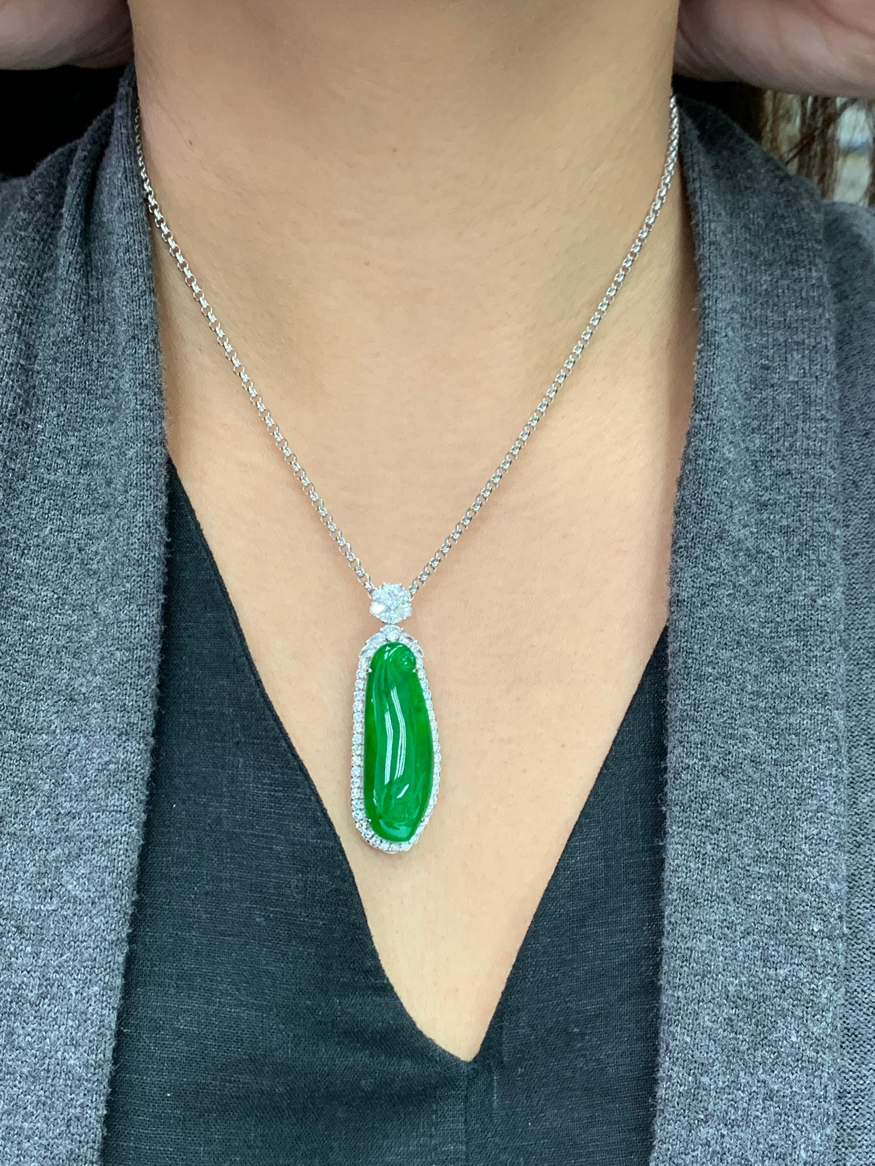 Please check out the HD video! Here is a rare imperial green Jade and diamond pendant. It is certified by 2 labs. The pendant is set in 18k white gold and diamonds. Not only does this jade have the best color, it is also has size and thickness. The