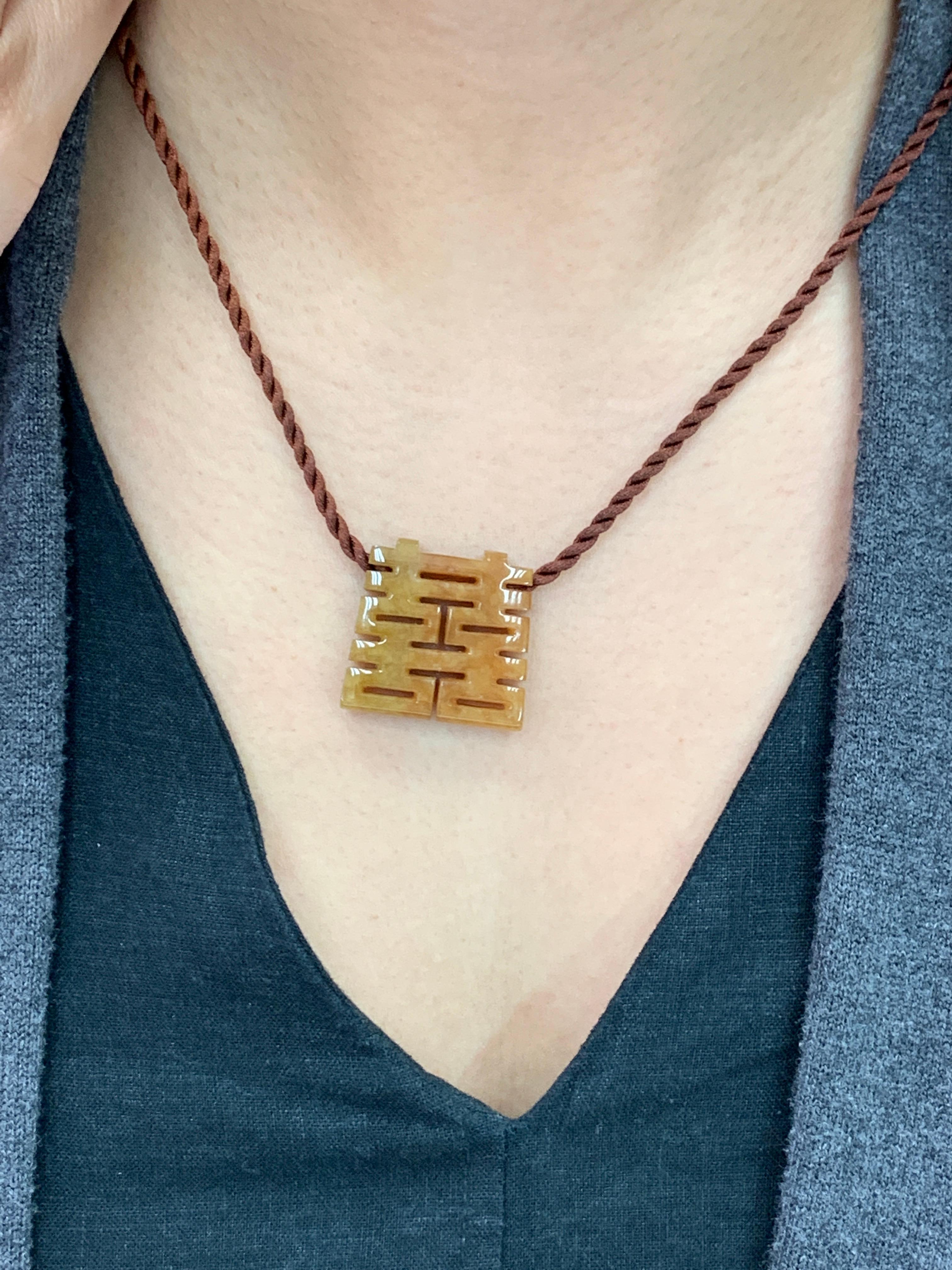 Here is an unusual Jade pendant. This pendant has that special brown (red) color that you don't see often. The pendant is also hollowed out from one bigger piece of jade rough material. This type of carving is not easy to do. The Chinese character