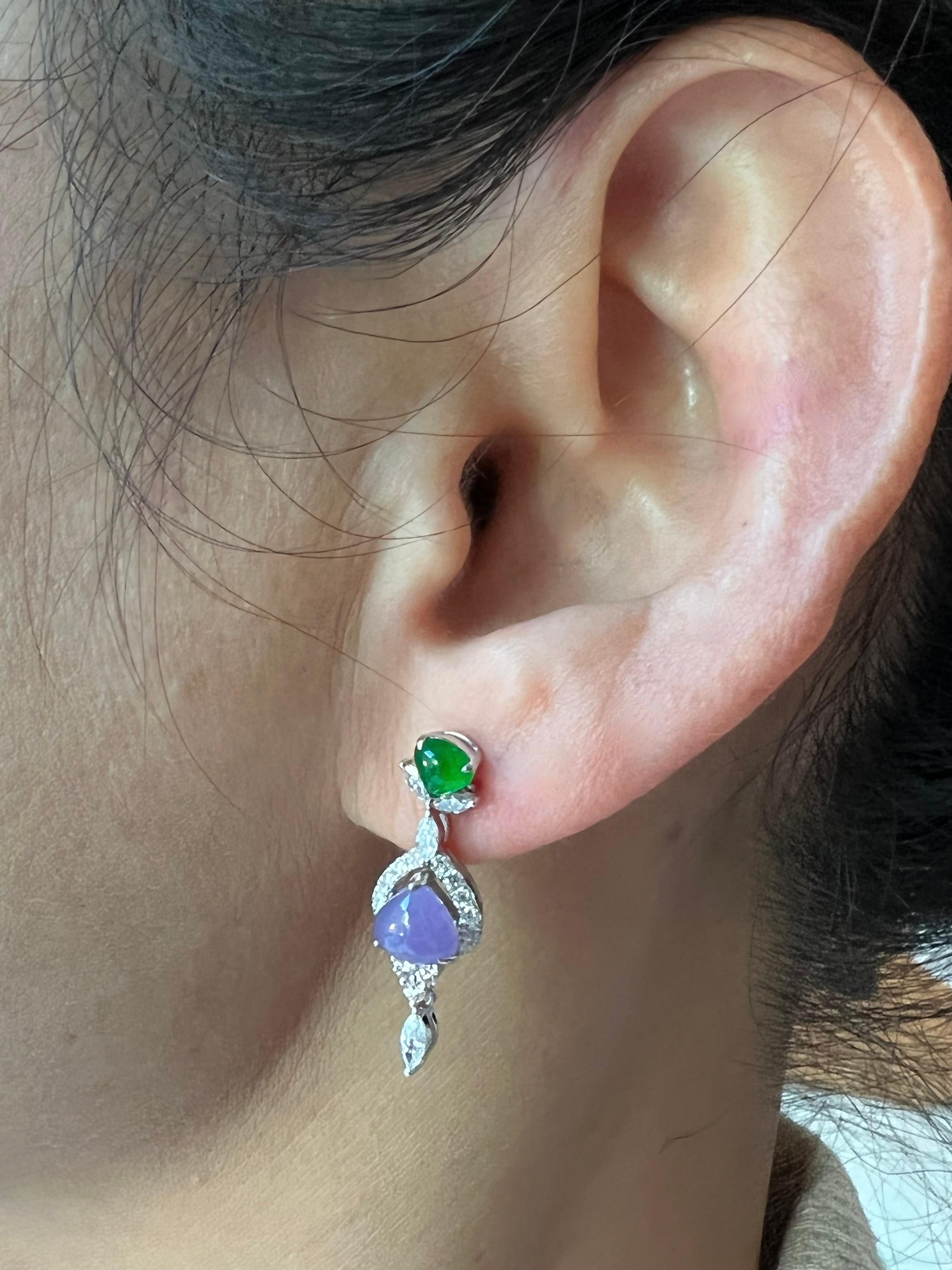 Please check out the HD video. This is a very special pair of drop earrings that are well designed with superb color combination. Certified by 2 labs. The jade materials used are also top notch. The lavender / purple jades in these earrings are