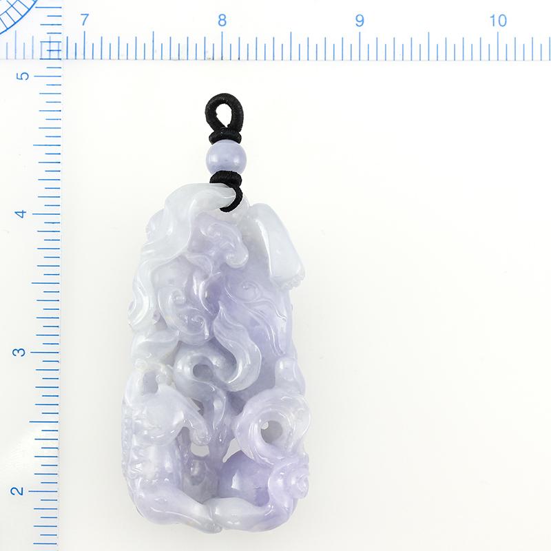 What an incredible piece! Natural large bluish lavender carved pendant or object d'art. This beautifully carved piece features two carved Fu Dogs with the Pearl of Wisdom. Exquisitely carved! The Fu Dog, or Dog of Fo are also known as Guardian