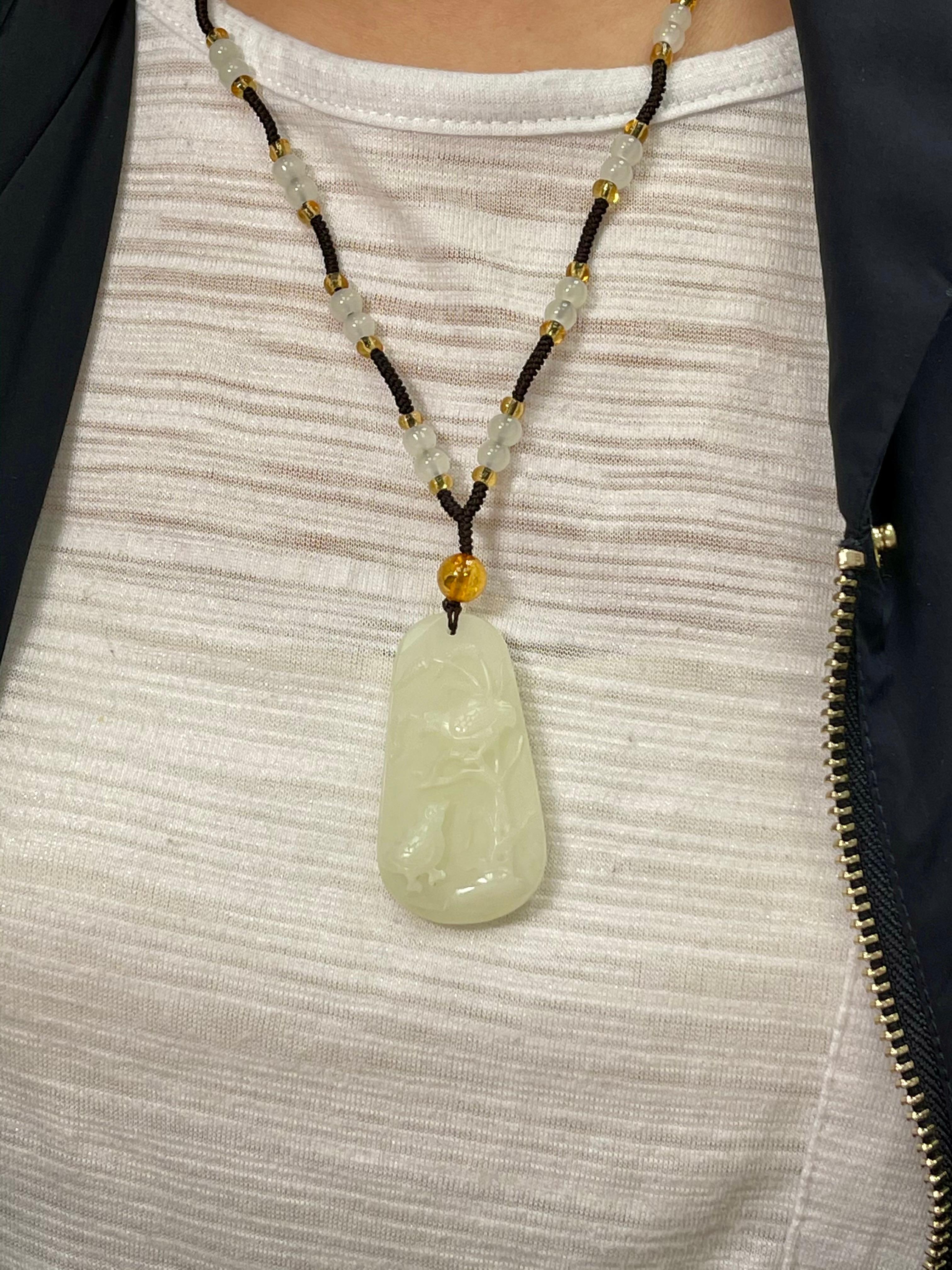 For your consideration is a certified natural nephrite jade necklace. This jade is very well carved. The jade carving is of scenic nature of birds and trees. The Hetian nephrite jade carving is close to being white. The photo (#3) that best