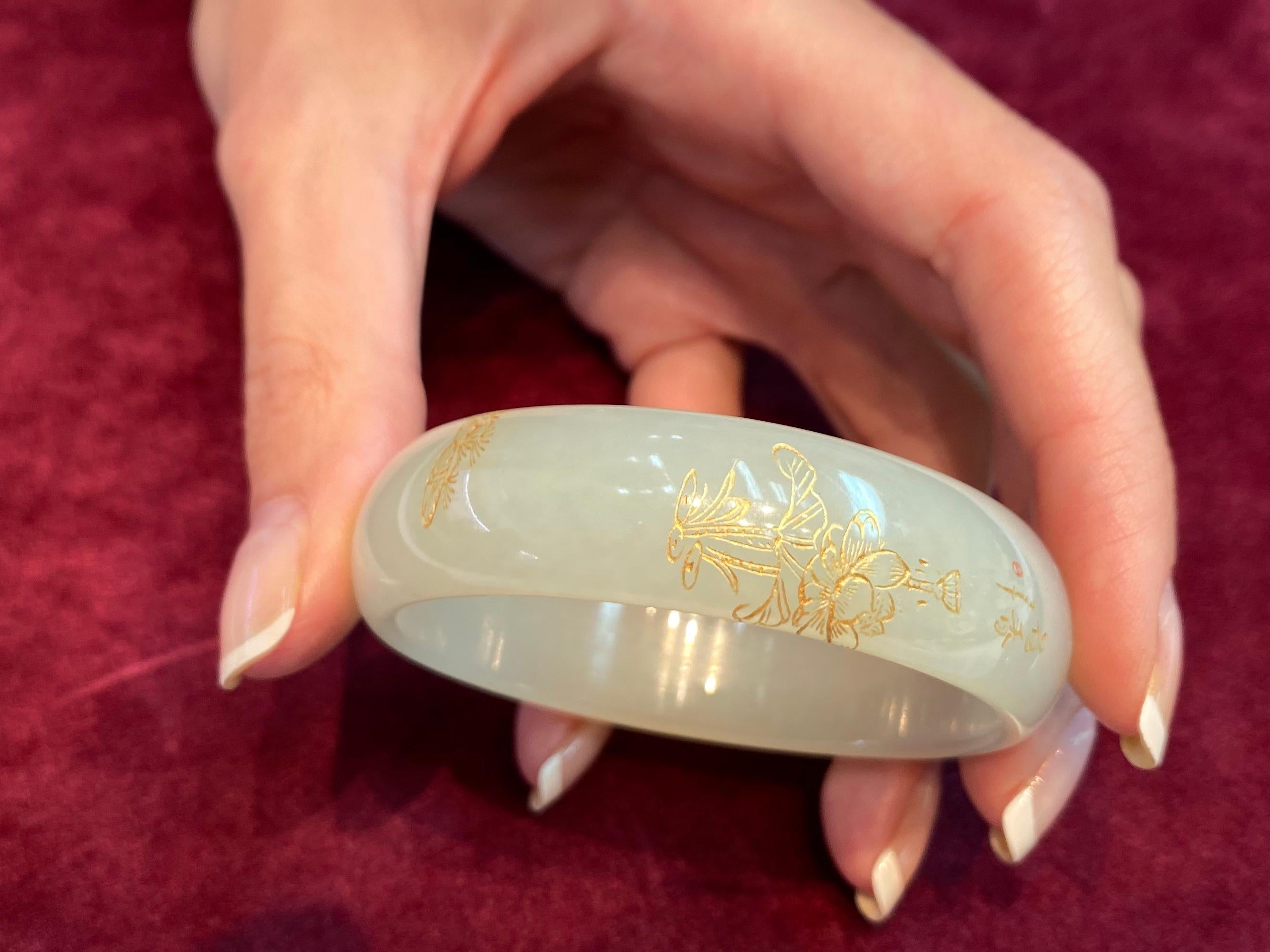 For your consideration is a certified natural nephrite jade bangle. This natural nephrite jade bangle is nicely carved and inlaid with gold. The carving of flowers are intricate. The two larger Chinese characters means 