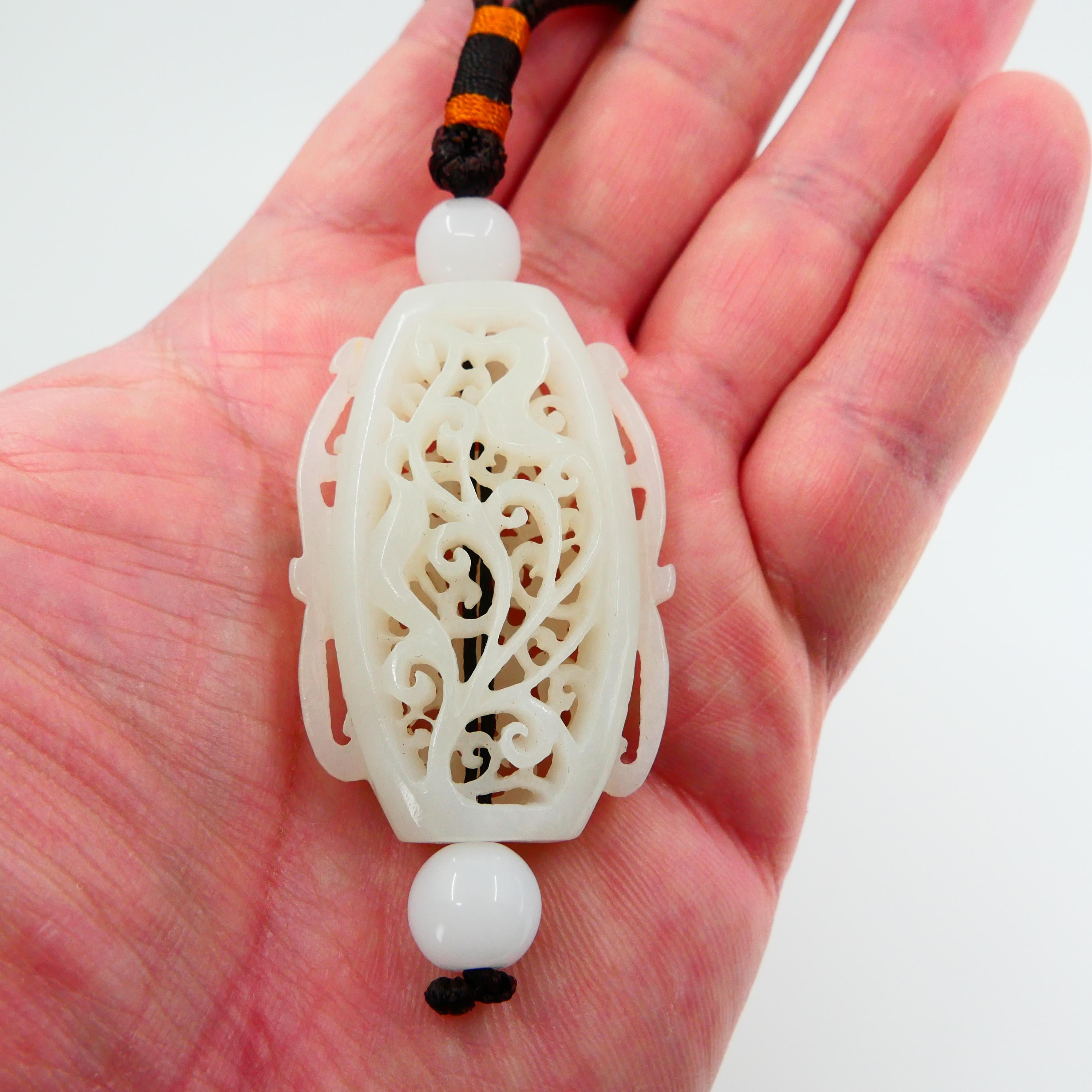 This is an unique piece for your consideration. The hand held decoration is certified natural nephrite jade. It is currently just an handheld decoration, however, can be converted into a pendant with a a traditional chinese cord for a different use.
