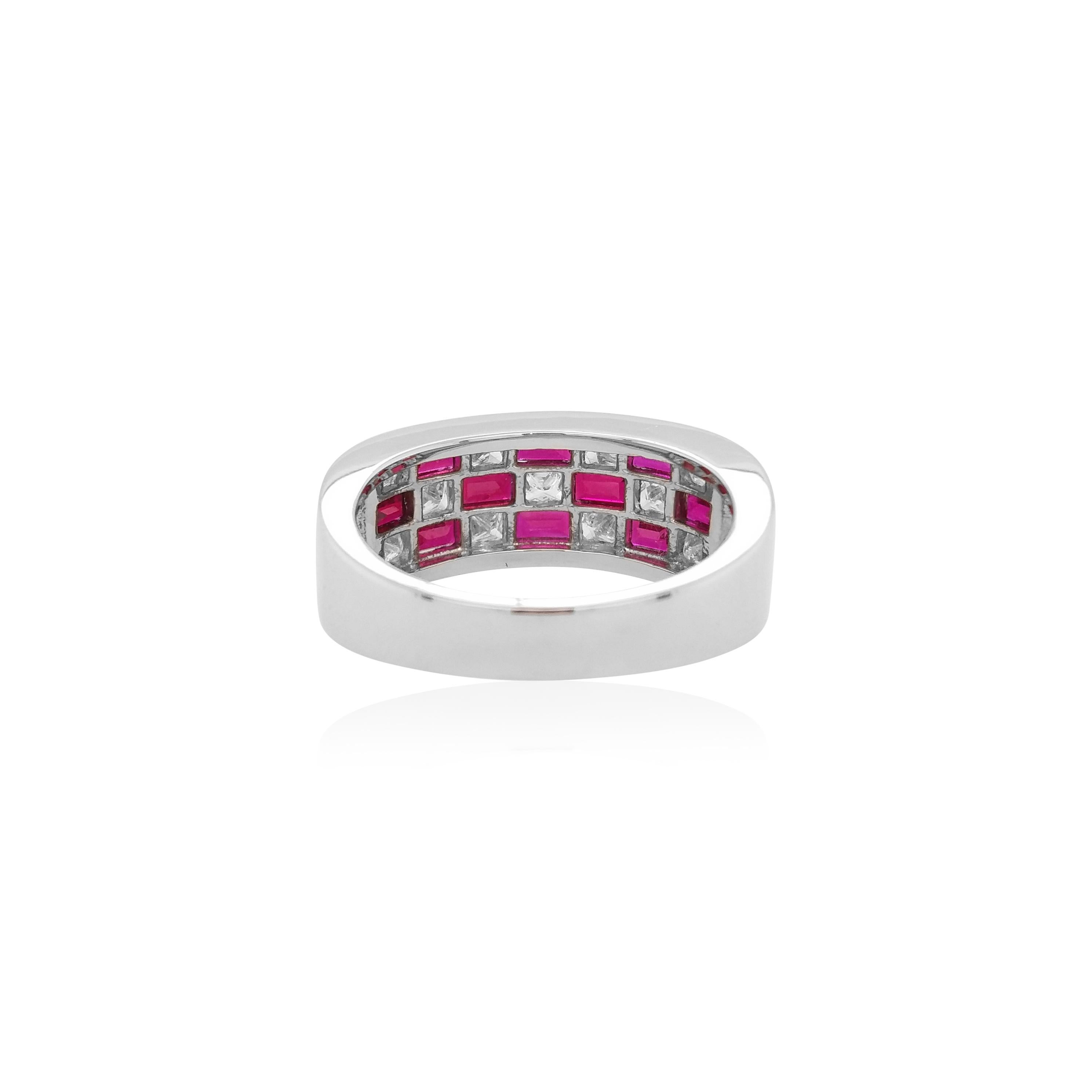 This striking platinum band ring features exceptional quality natural no-heat treated Rubies set amongst scintillating sparkling White Diamonds at its front. Set in platinum to provide a unique, but elegant contrast to the colour of the rubies and