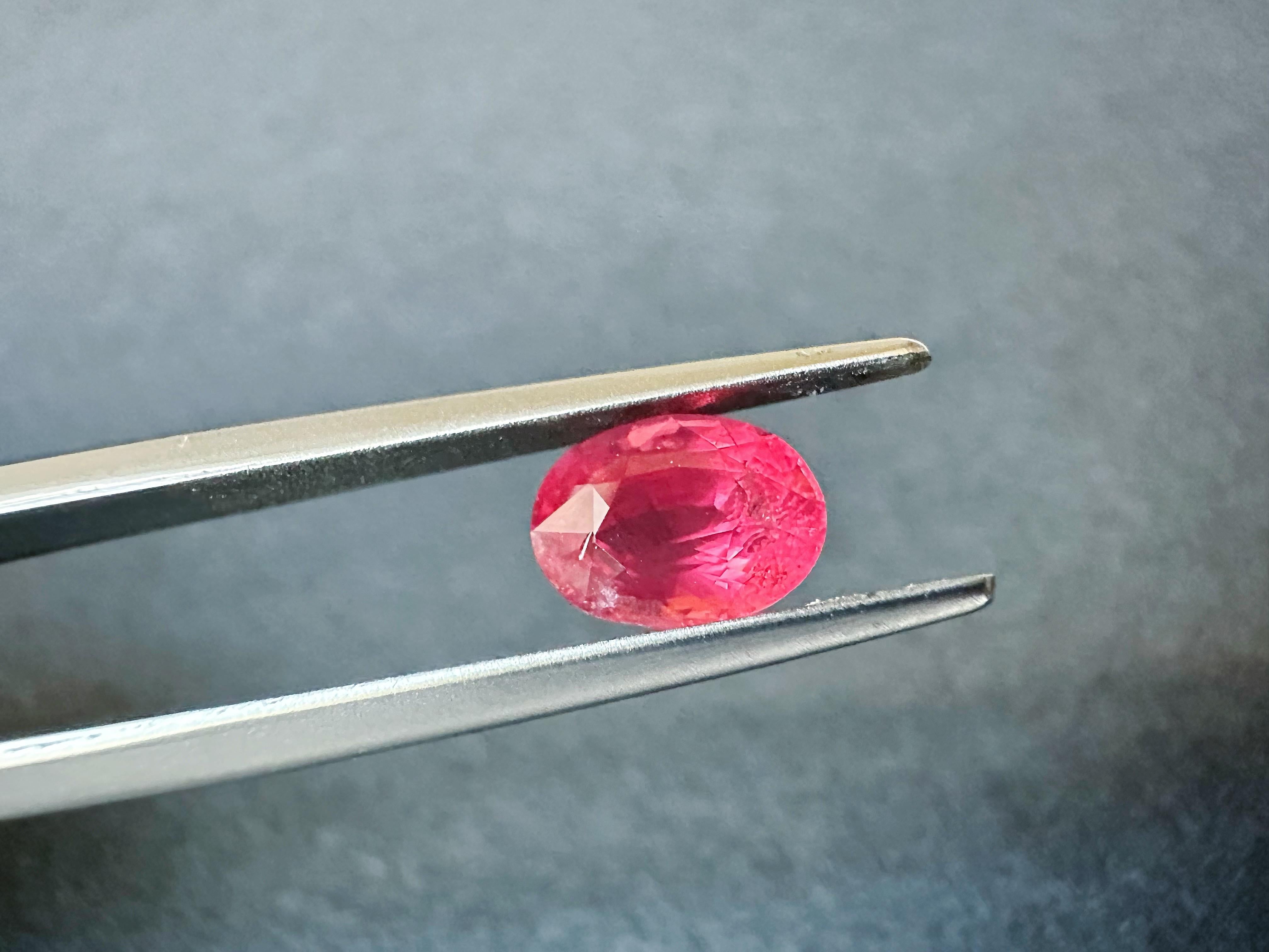 Introducing our exquisite Mahenge spinel with a stunning glass body orangy red color that is sure to captivate the eye. This gemstone is a true wonder of nature, with its vibrant and fiery hue that radiates energy and passion.

Sourced from the