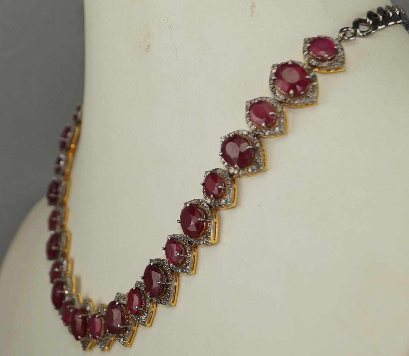 This beautiful ruby diamond necklace consists of:

Diamond- Pave diamonds
Diamond color- white with a tint of grey
Diamond origin- Natural
Diamond weight- 8.30ct

Gemstone- Ruby
Gemstone color- Plum red

Metal- Silver
Metal purity- Sterling