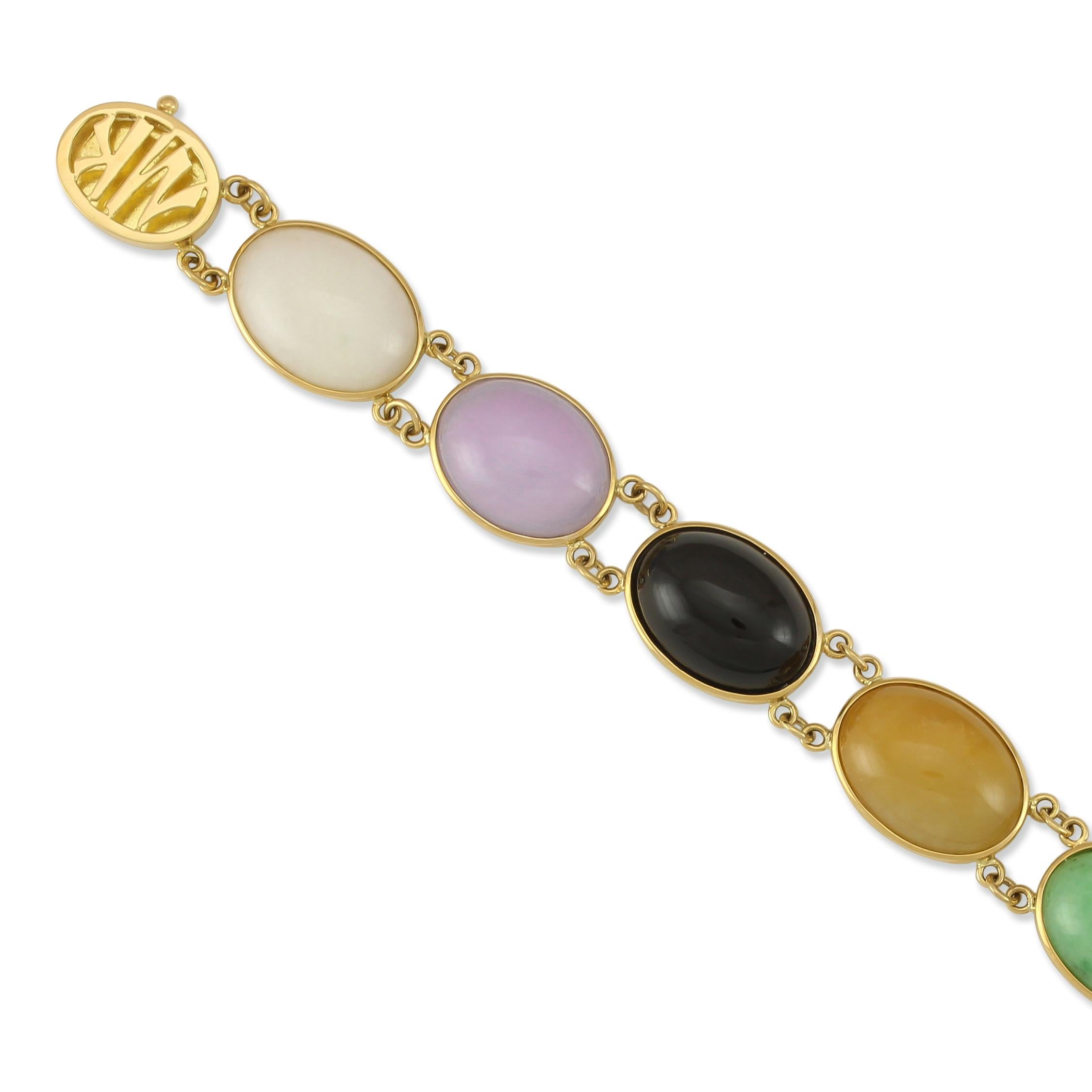 A Classic Mason-Kay Bracelet Style. 7 amazing large vivid natural jade cabochons in a rainbow array of colors all bezel set in 14k yellow gold with a Mason-Kay Signature 14K yellow gold clasp. The bracelet is 7 inches long. 

7 Rainbow Jade