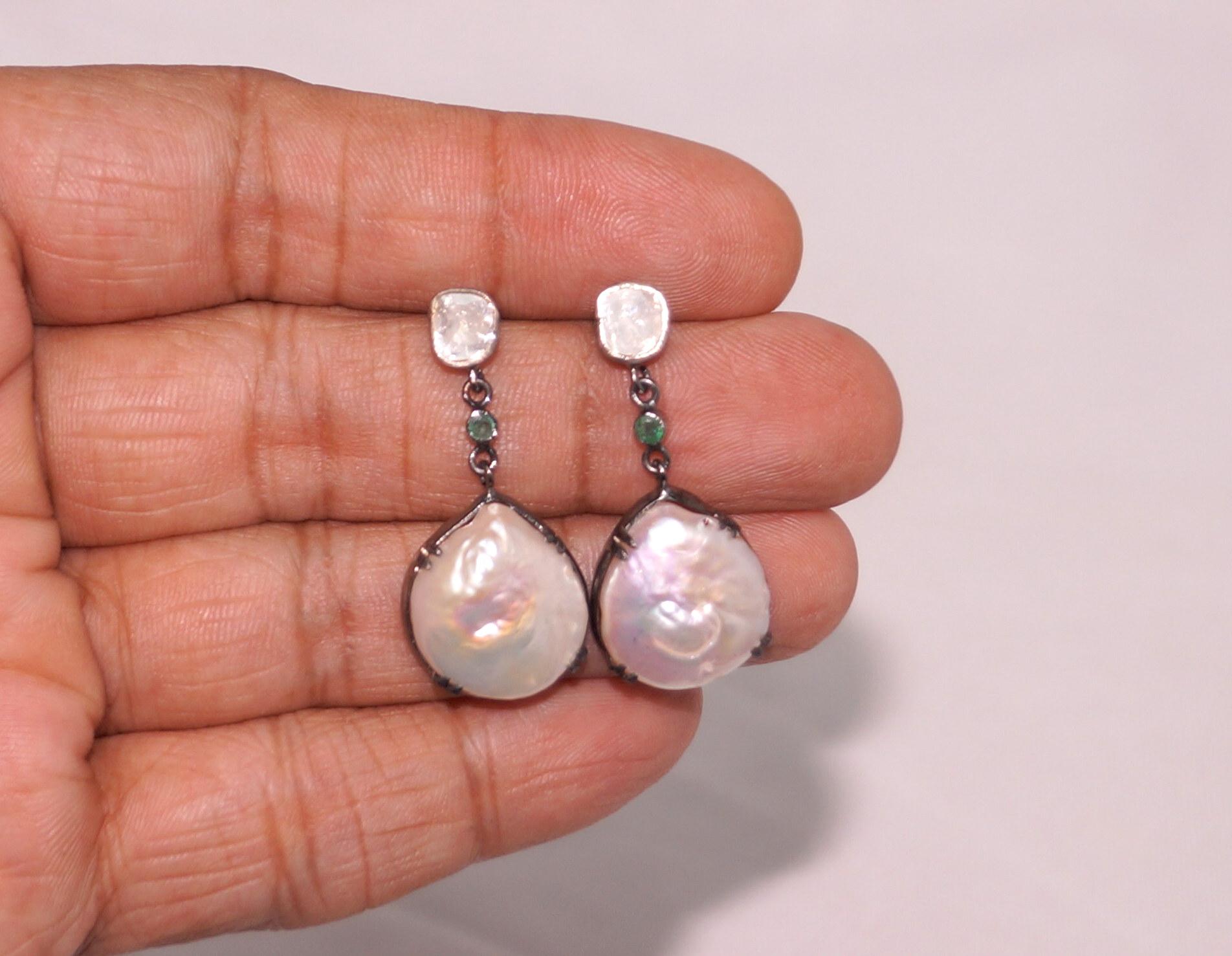 Stunning Baroque Pearl diamond sterling silver earrings consists of :

Main Gemstone- Pearl
Type- Natural Baroque pearl
Metal- Silver
Metal Purity- sterling silver
Color of metal- oxidized silver Look
Diamond- Natural uncut diamonds and rose cut