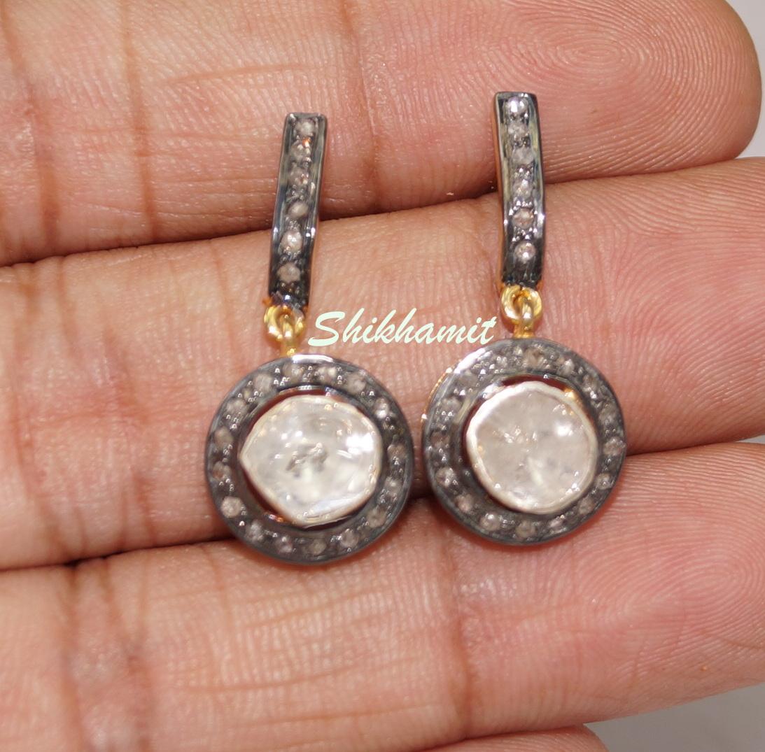 Stunning diamond sterling silver earrings consists of :

Metal- Silver
Metal Purity- sterling silver
Color of metal- Yellow gold plating 
Diamond- Natural uncut diamonds and rose cut diamonds
Diamond origin- Natural earth mined
Diamond weight-