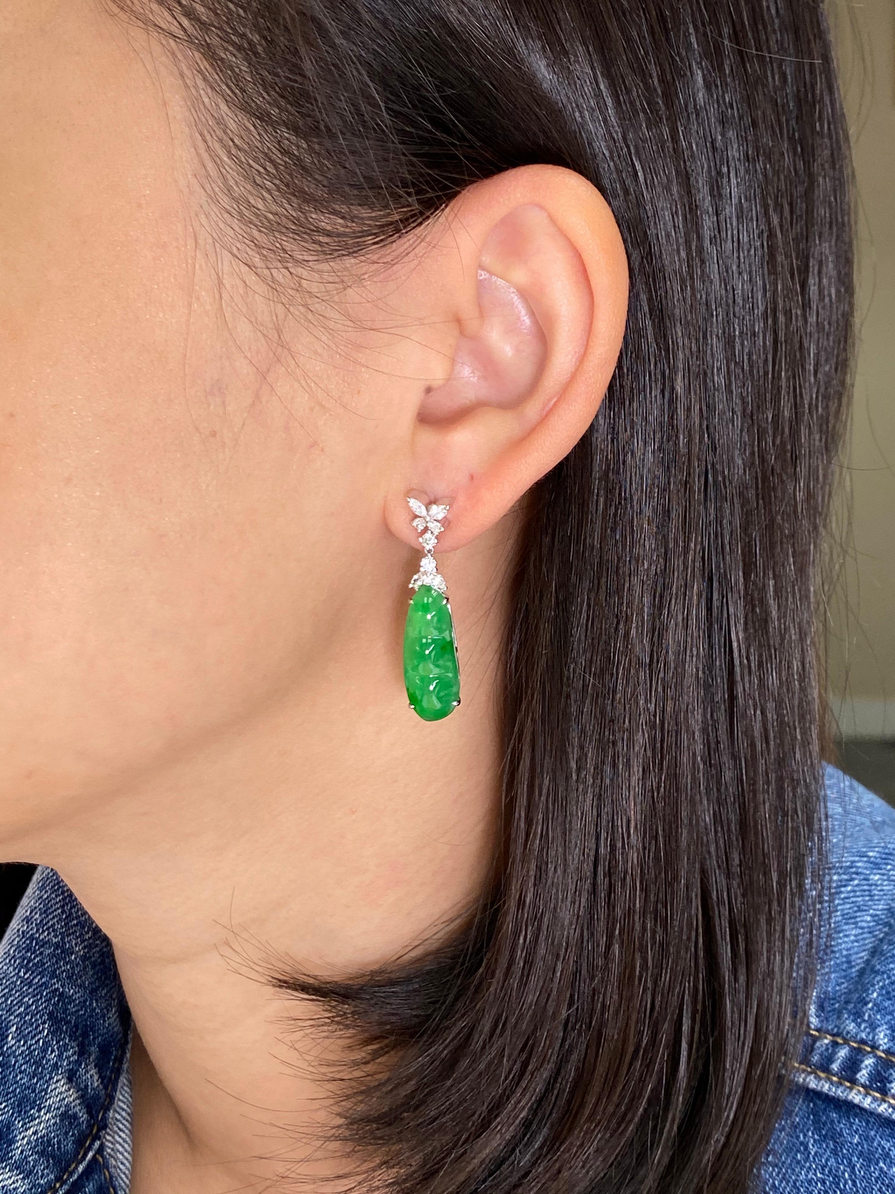 These icy jade apple green earrings are certified by 2 labs. Here is a nice pair of apple green icy Jadeite Jade earrings. The earrings are about 3.5 cm long and 0.8 cm wide each. The earrings are set in 18k white gold, and white diamonds. The 2