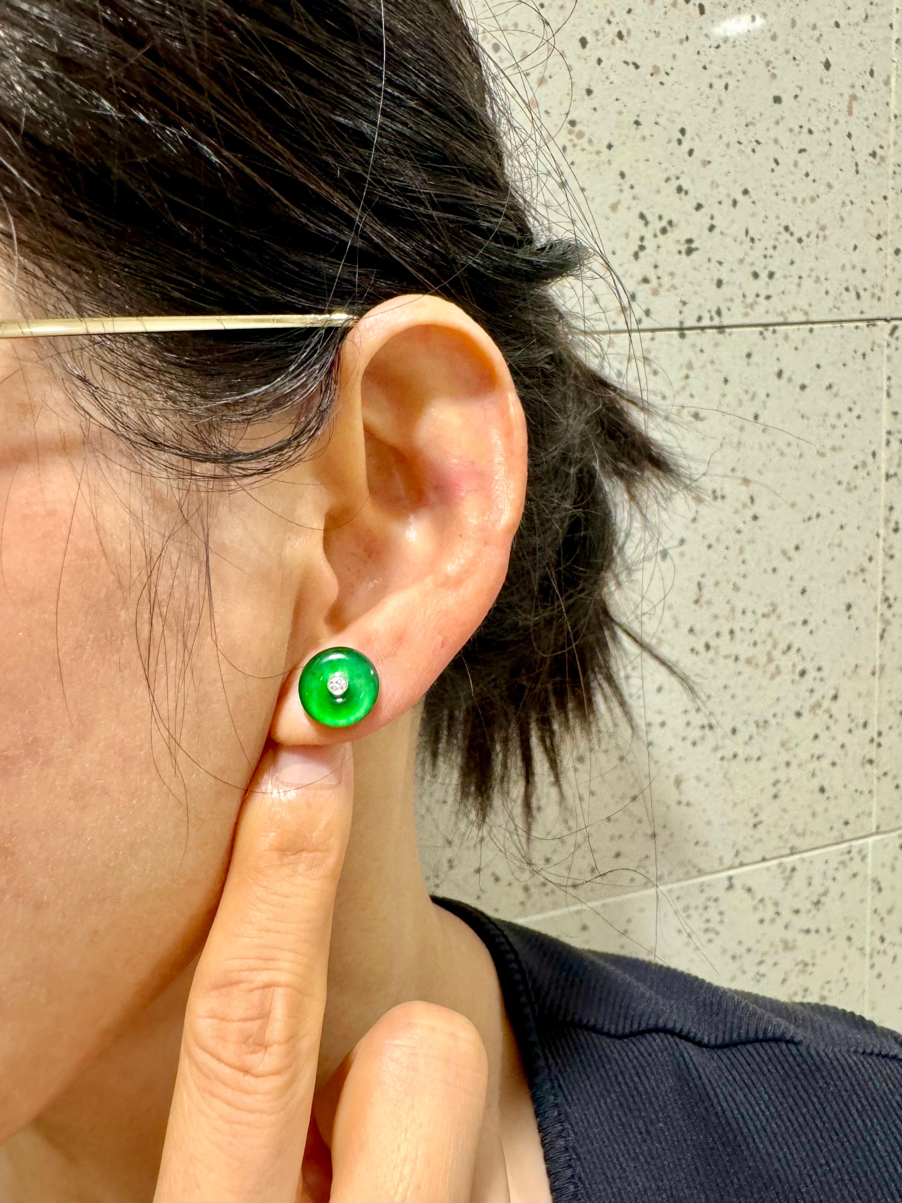 Please check out the HD video! It does not get much better than this! Here is a nice pair of imperial green Jade earrings. Each earring is about 11.3mm. The earrings are set in 18k white gold and diamonds. There are 2 diamonds in the middle of each