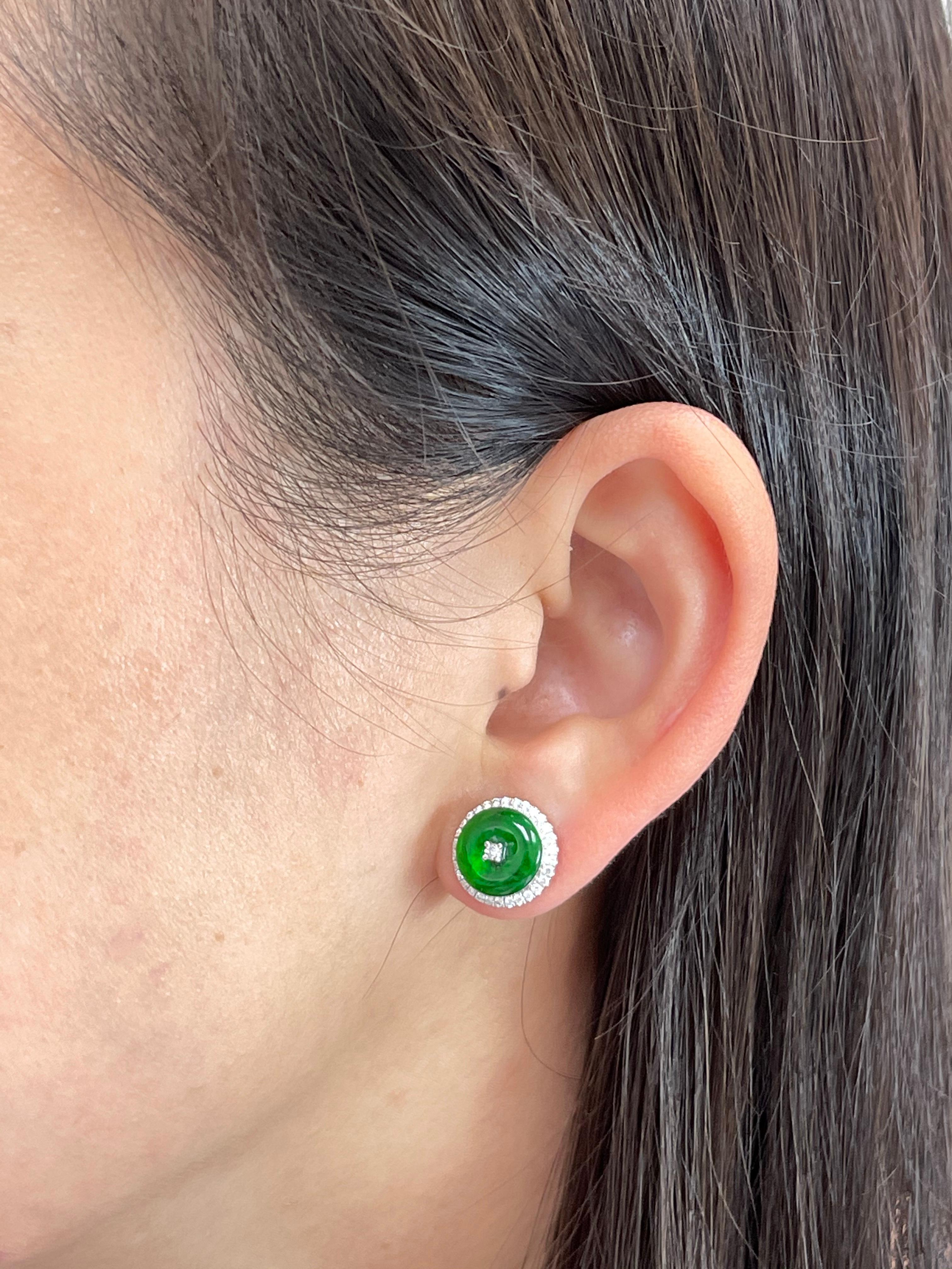 Here is a nice pair of spinach green Jade earrings. The diameter is about 12mm each. The earrings are set in 18k white gold and diamonds. There are 62 white diamonds that makes up the halo totaling 0.41cts. The untreated / unenhanced natural jade is