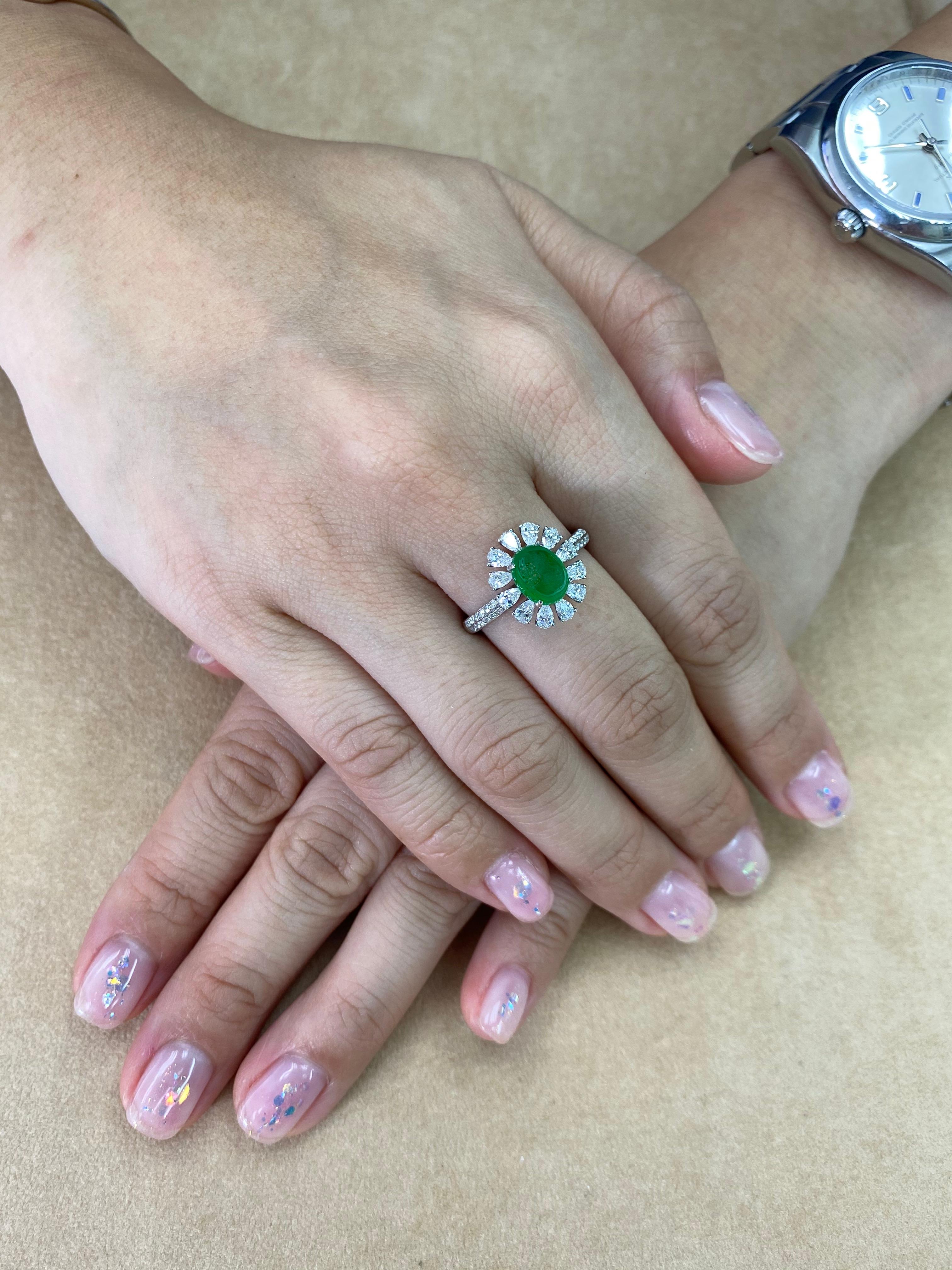 Please check out the HD video! THIS JADE GLOWS! Here is an apple green Jade and diamond ring. It is certified by 2 labs as natural jadeite jade with no treatment or enhancement. The ring is set in 18k white gold and diamonds. There are 12 pear