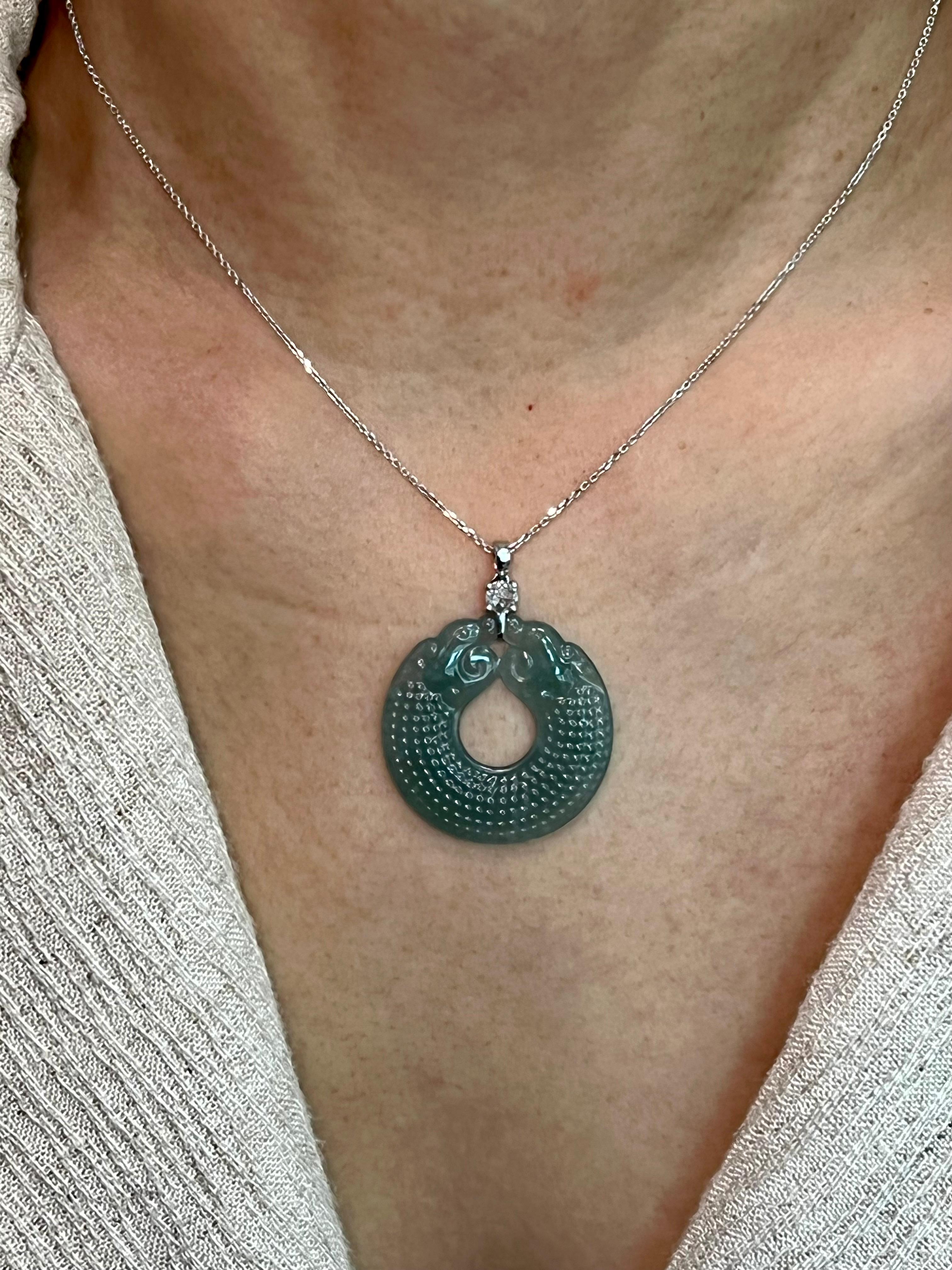 Please check out the HD video! This Jade pendant is custom cut and certified. The pendant is set in 18k white gold, with a new rose cut diamond. The new rose cut diamond is about 3.7mm in diameter. The untreated / un-enhanced natural jade is